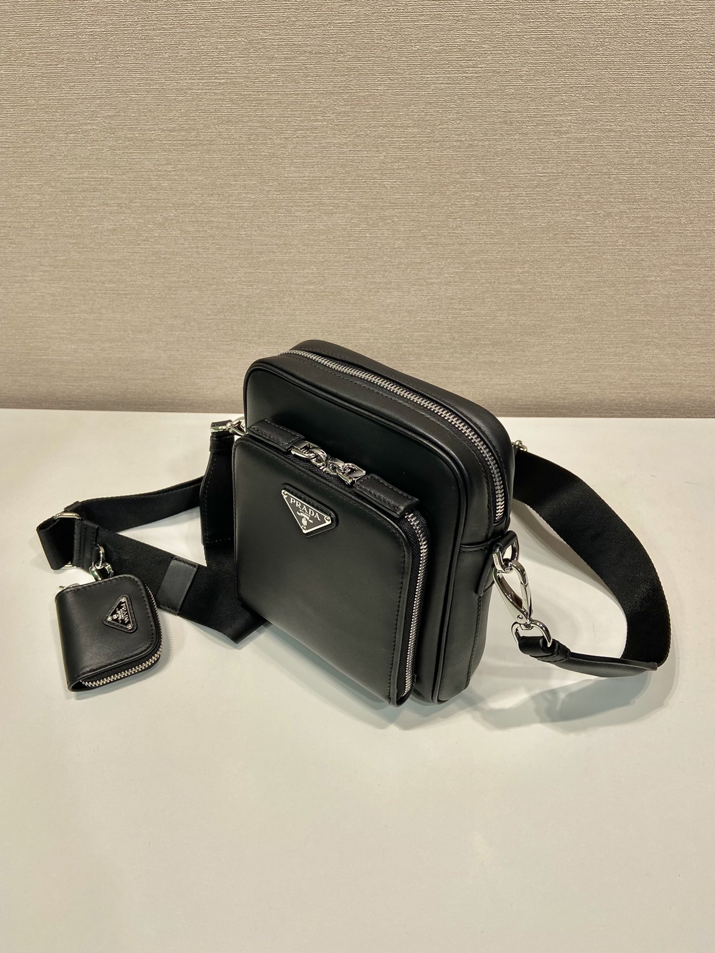 Pra*a leather shoulder bag with pouch