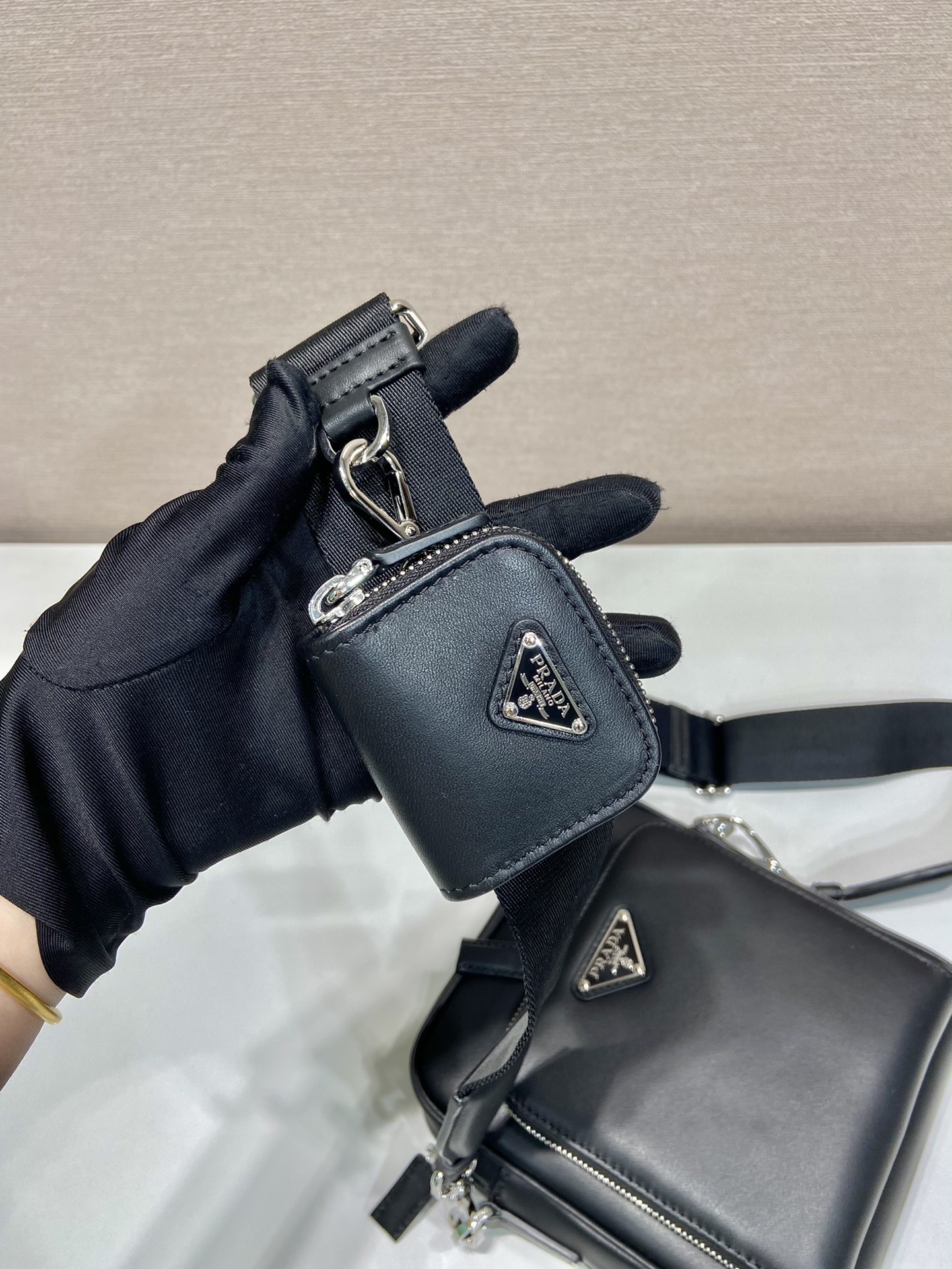 Pra*a leather shoulder bag with pouch