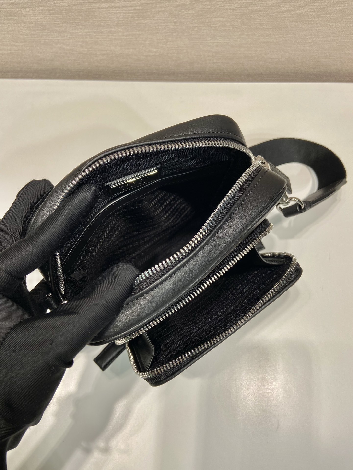 Pra*a leather shoulder bag with pouch