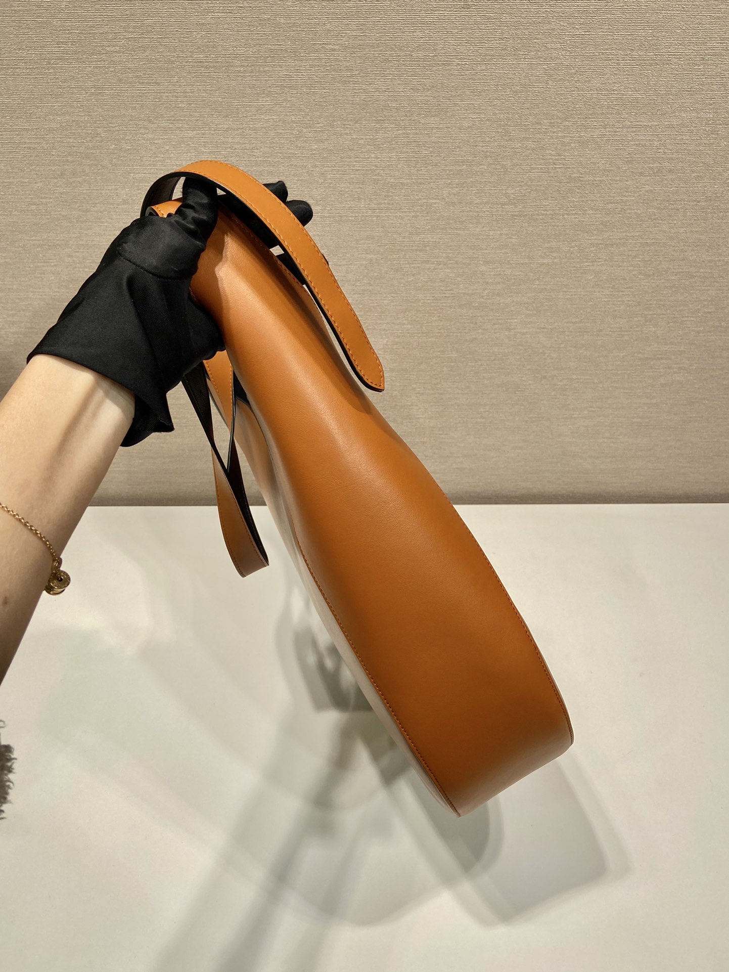 Pra*a large leather shoulder bag with topstitching