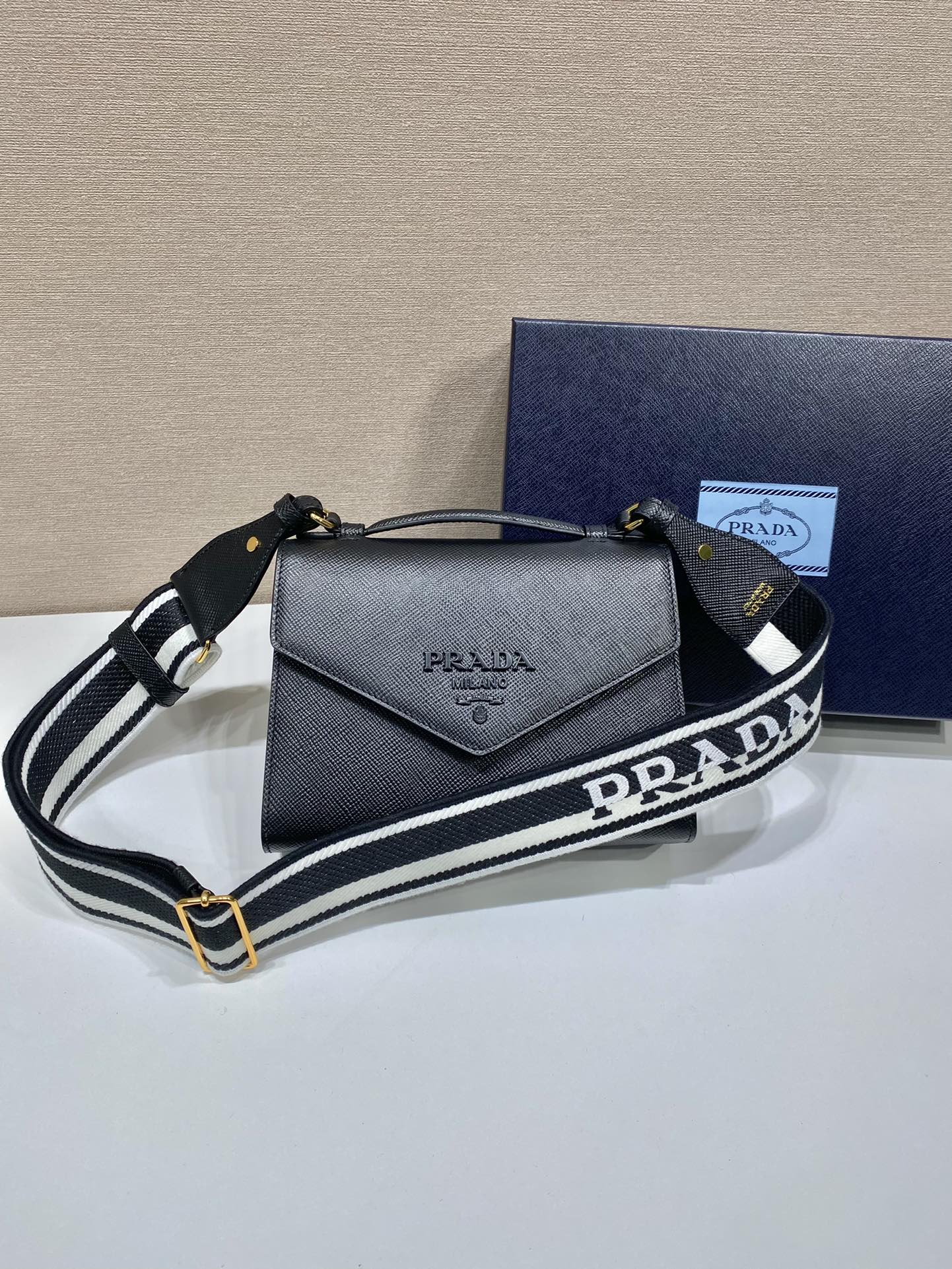 Pra*a monochrome saffiano and leather bag
