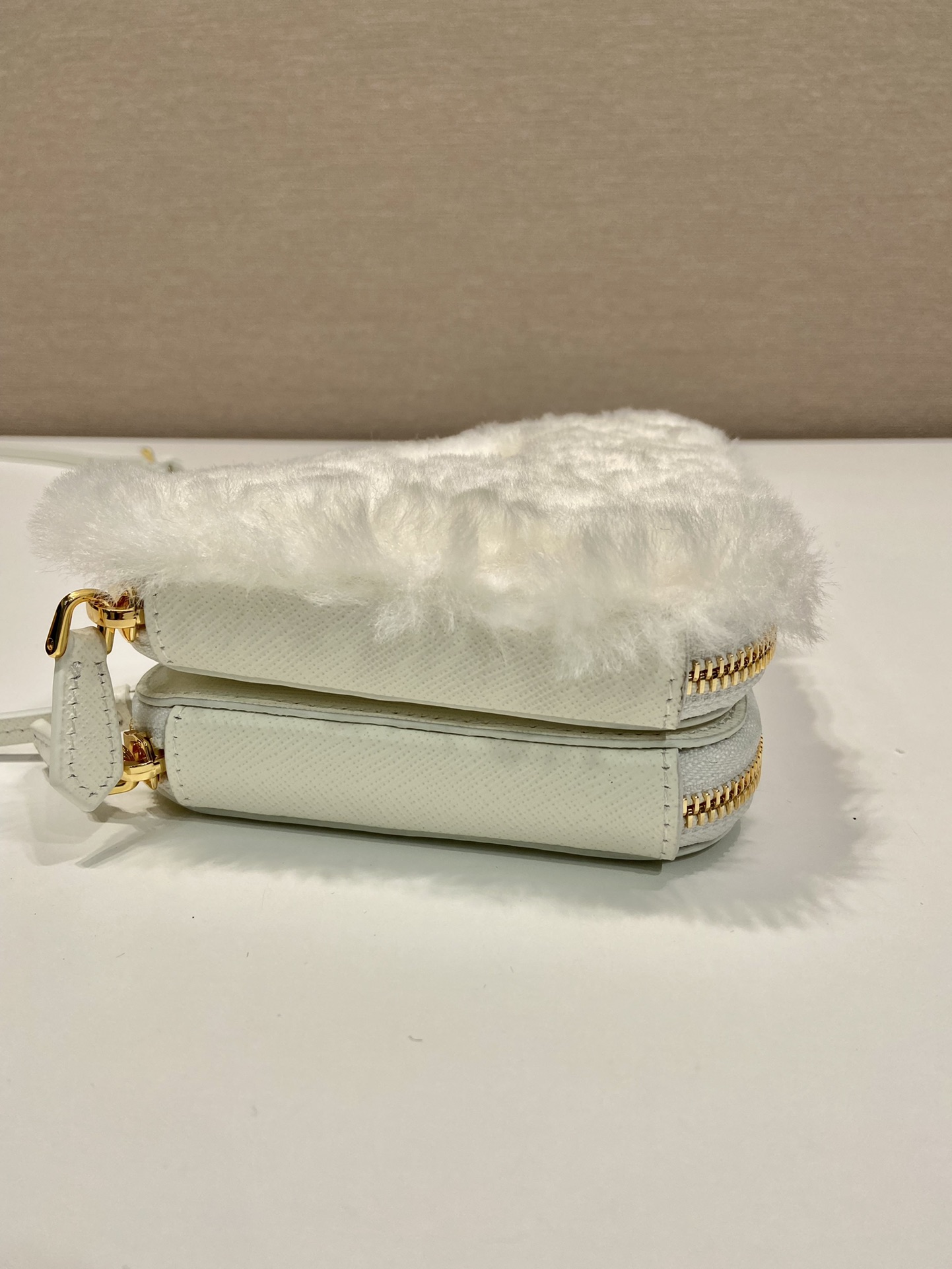 Pra*a shearling and saffiano leather mini-pouch