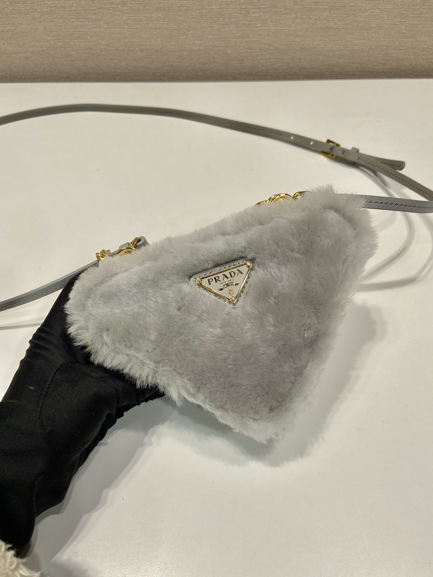 Pra*a shearling and saffiano leather mini-pouch