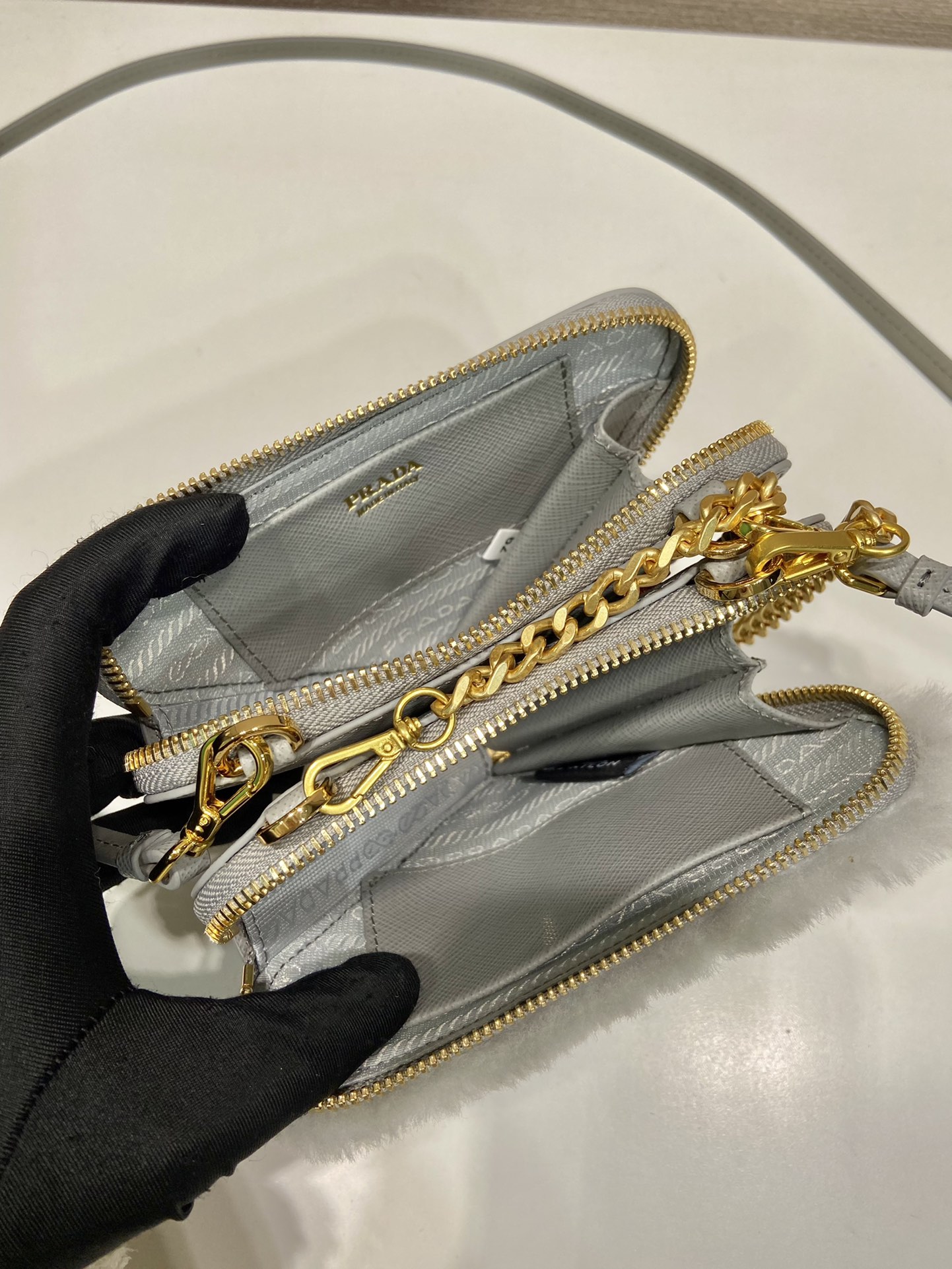 Pra*a shearling and saffiano leather mini-pouch