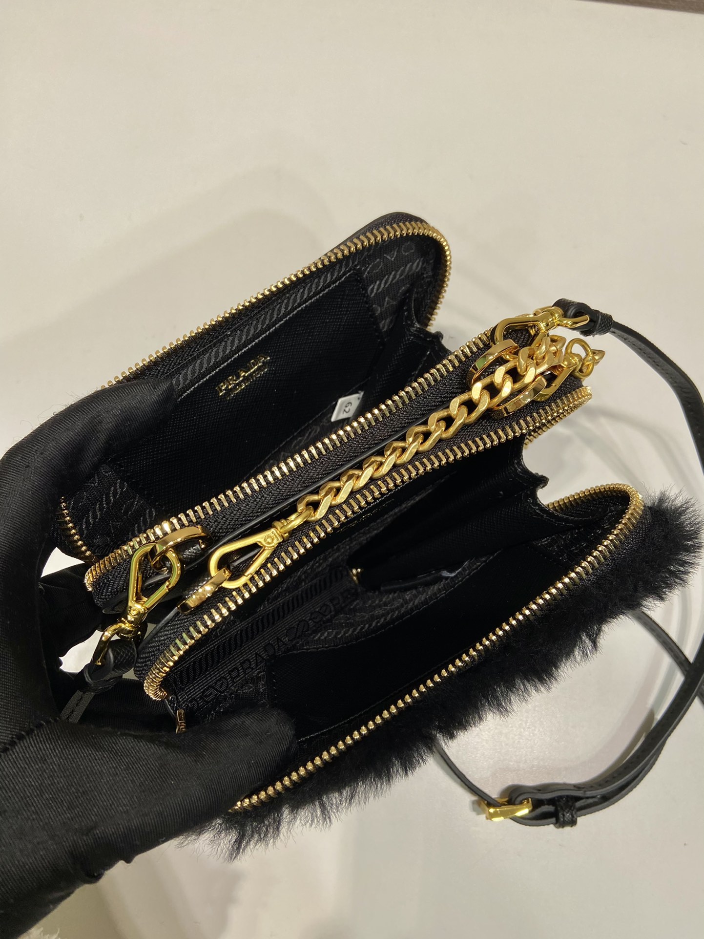 Pra*a shearling and saffiano leather mini-pouch