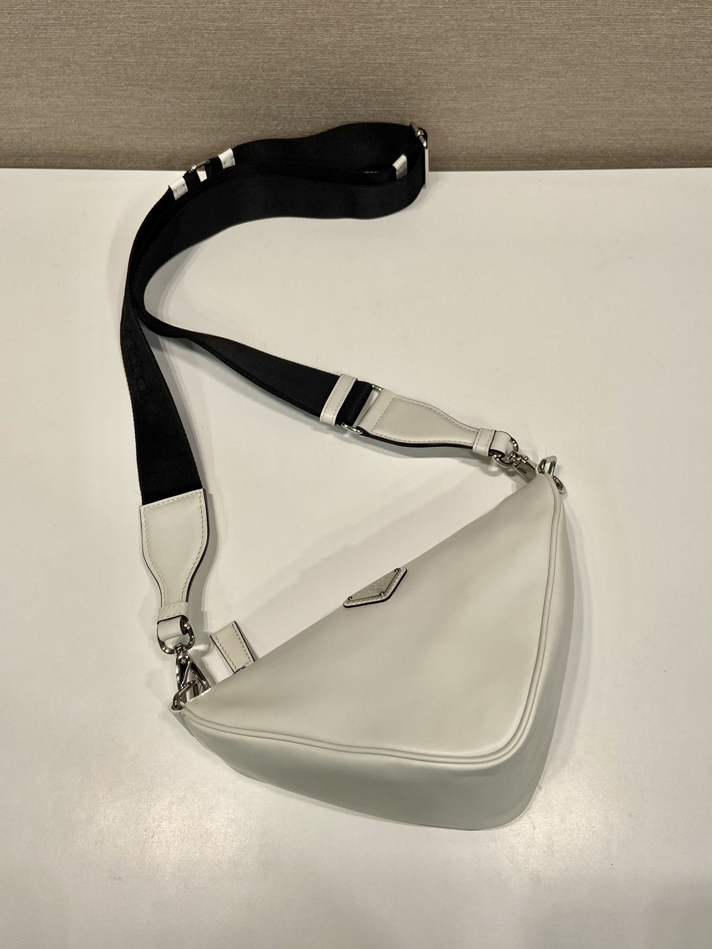 saffiano Pra*a triangle bag