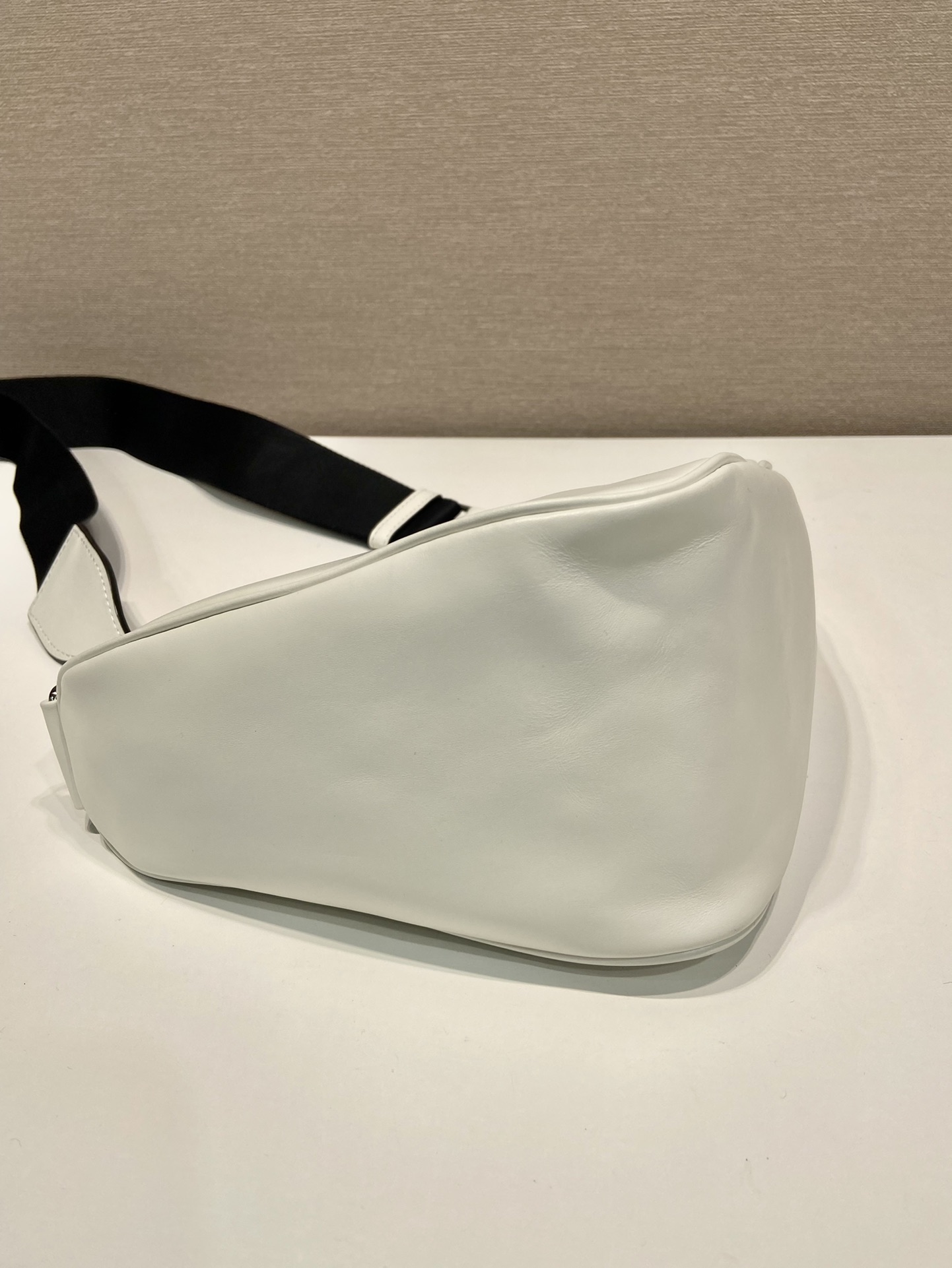 saffiano Pra*a triangle bag