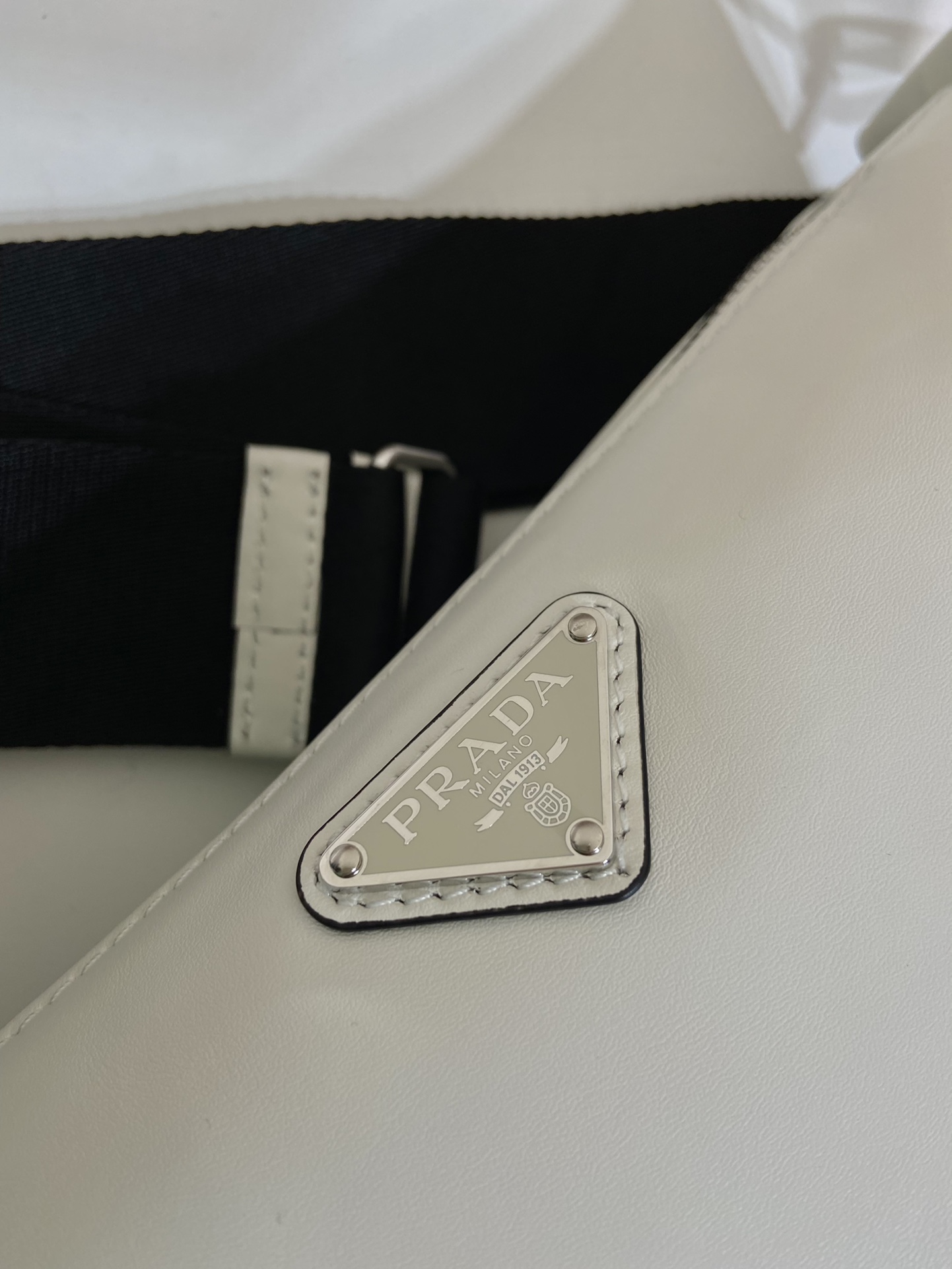 saffiano Pra*a triangle bag