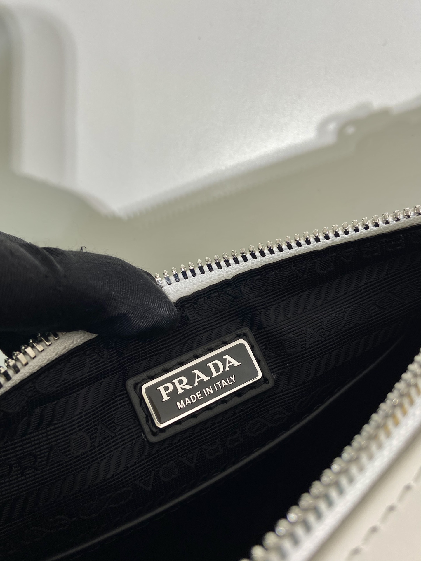 saffiano Pra*a triangle bag