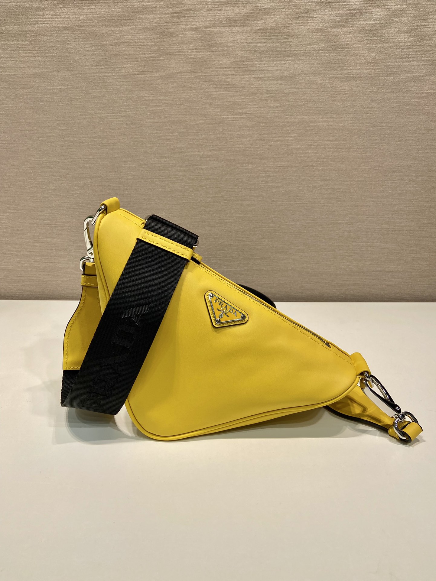 saffiano Pra*a triangle bag
