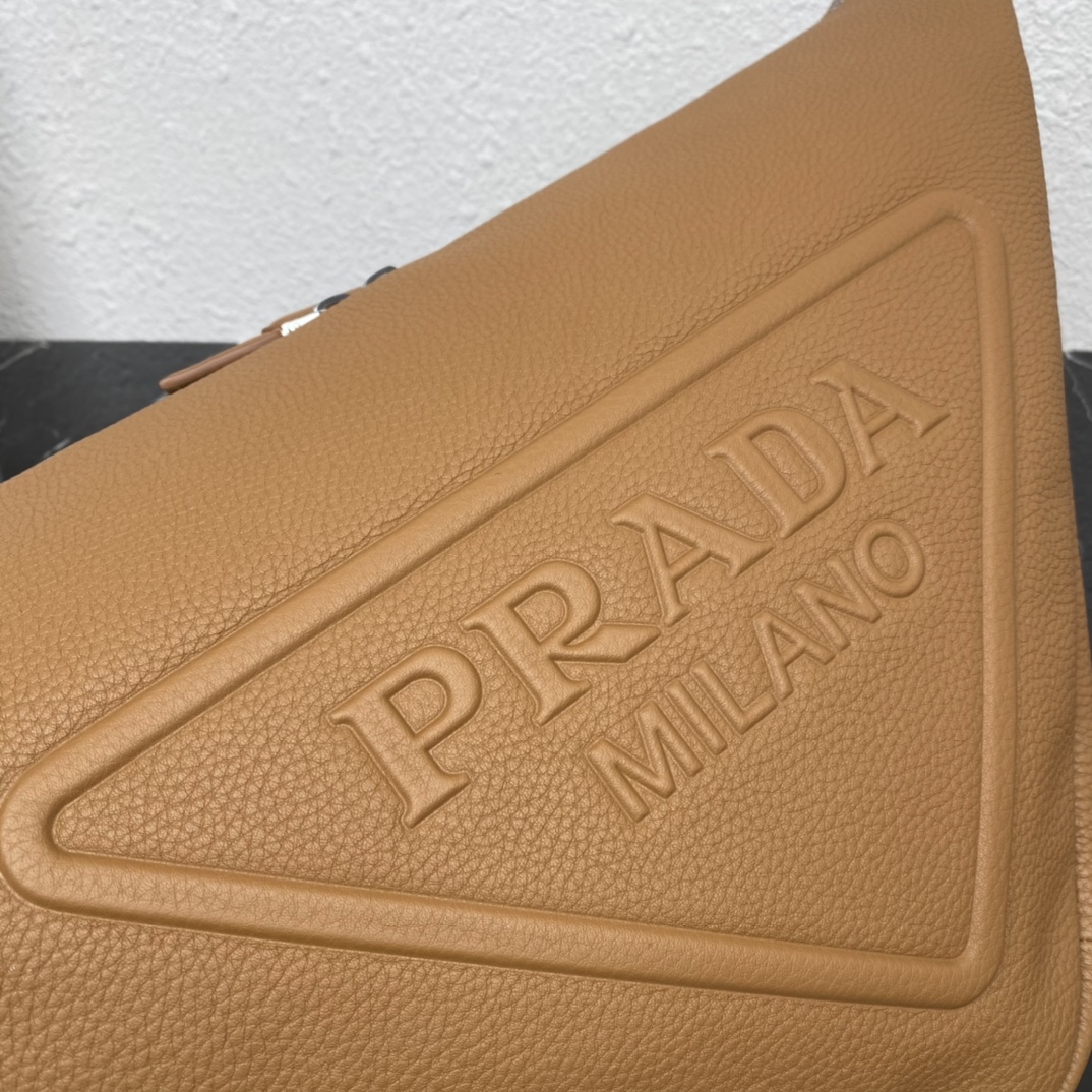 large leather Pra*a triangle bag