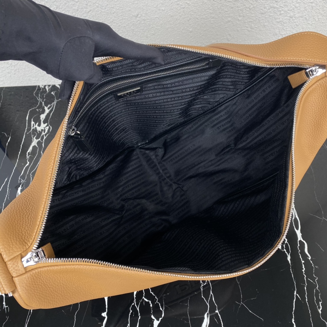 large leather Pra*a triangle bag