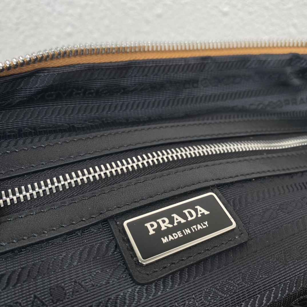 large leather Pra*a triangle bag