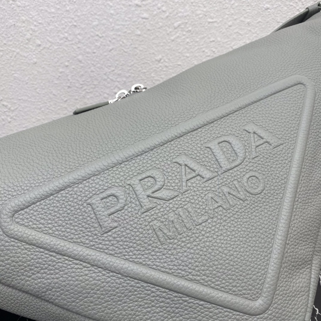 large leather Pra*a triangle bag