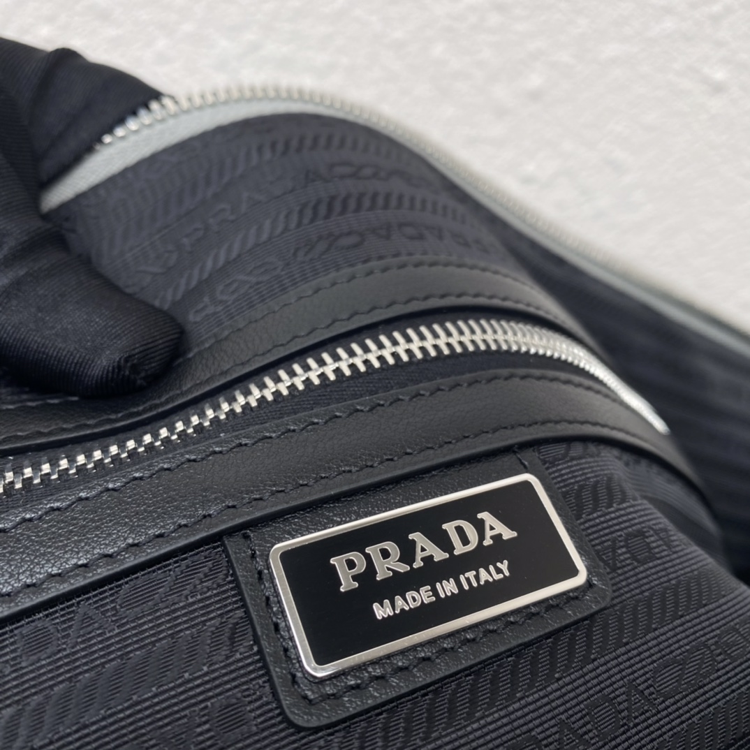 large leather Pra*a triangle bag