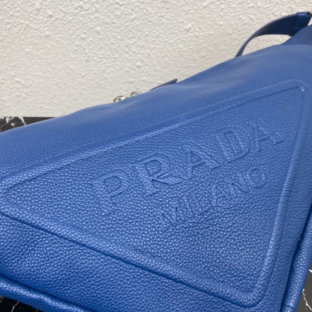 large leather Pra*a triangle bag