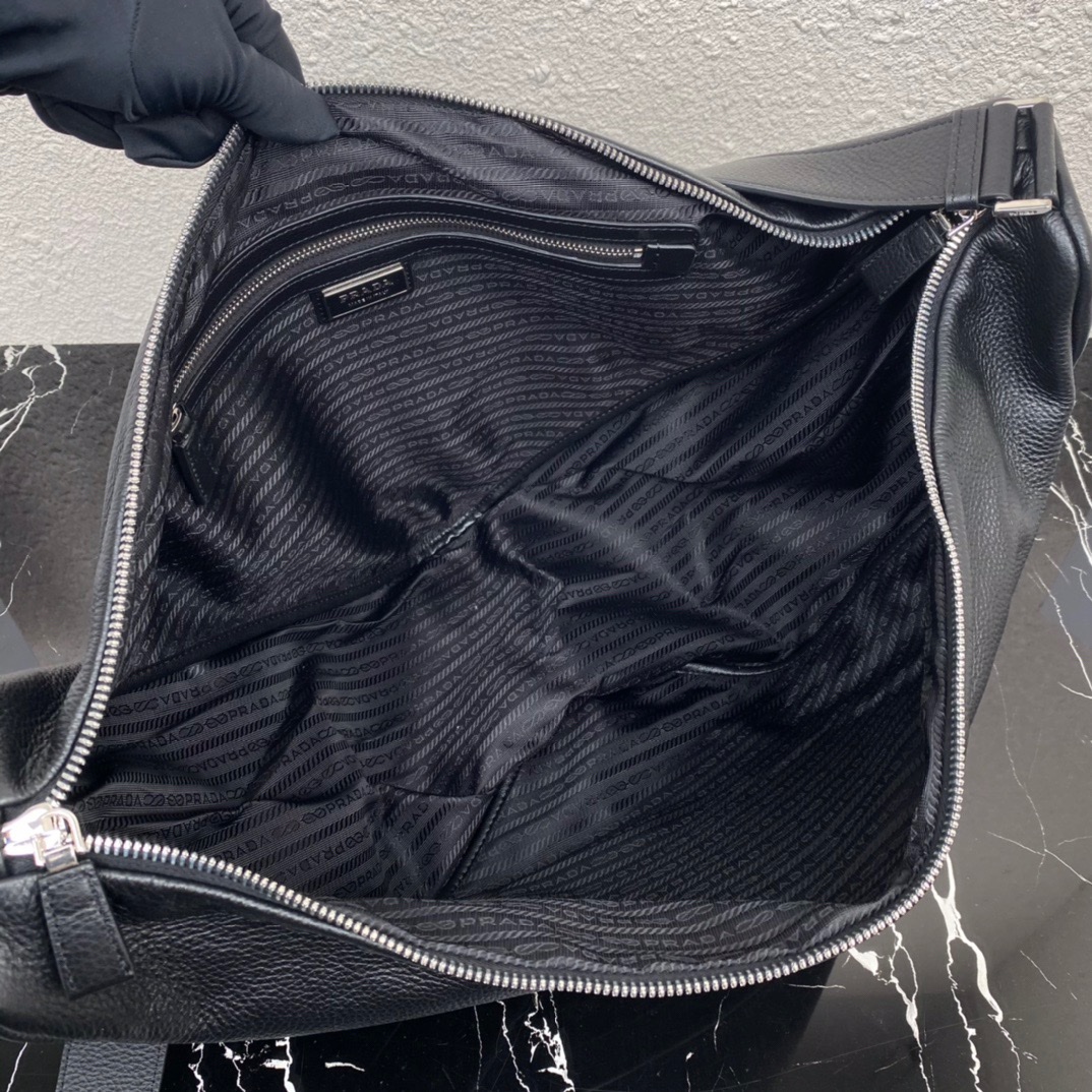 large leather Pra*a triangle bag