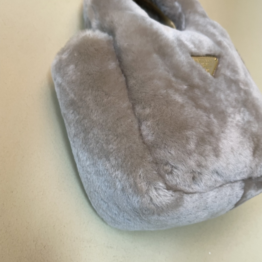 Pra*a shearling mini handbag