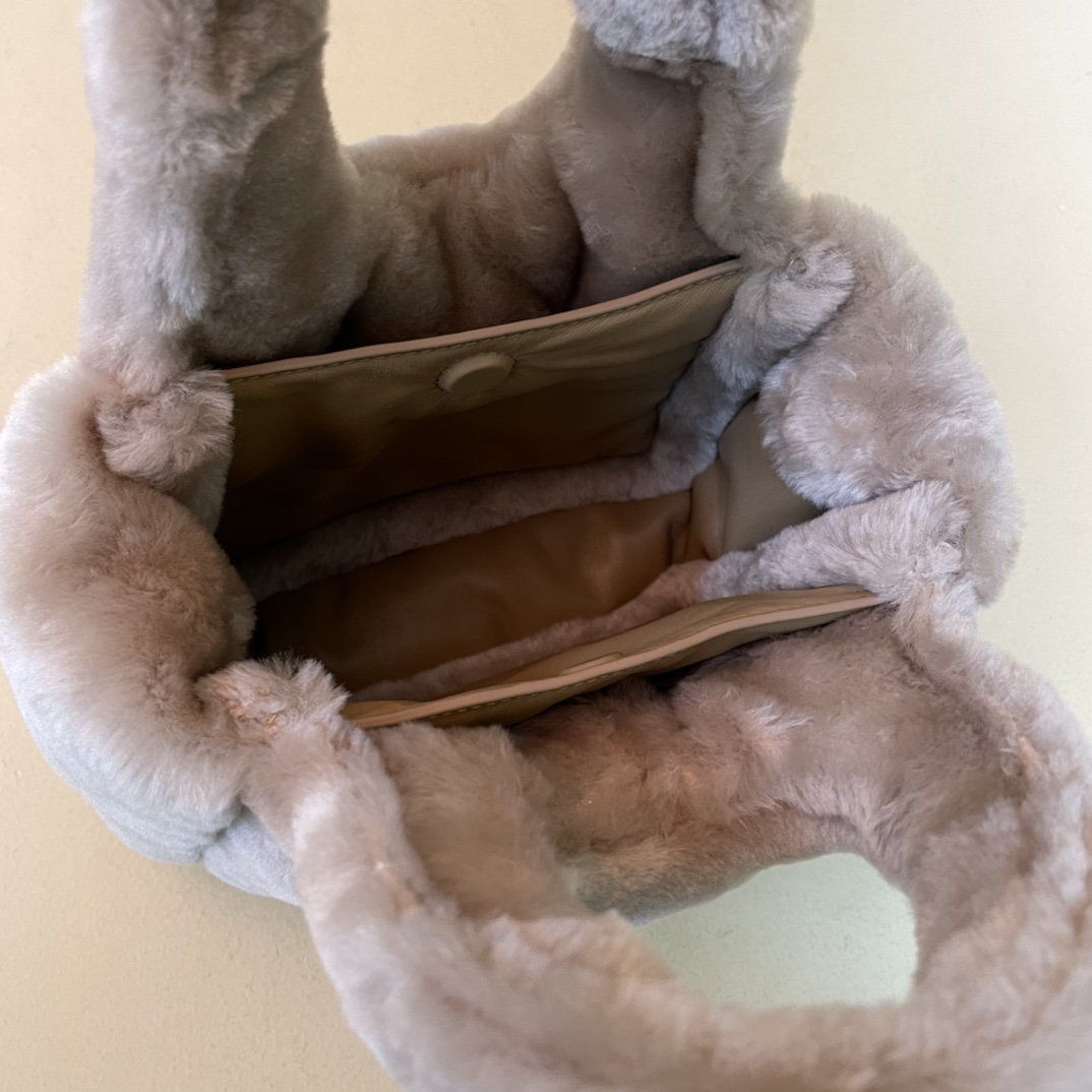 Pra*a shearling mini handbag