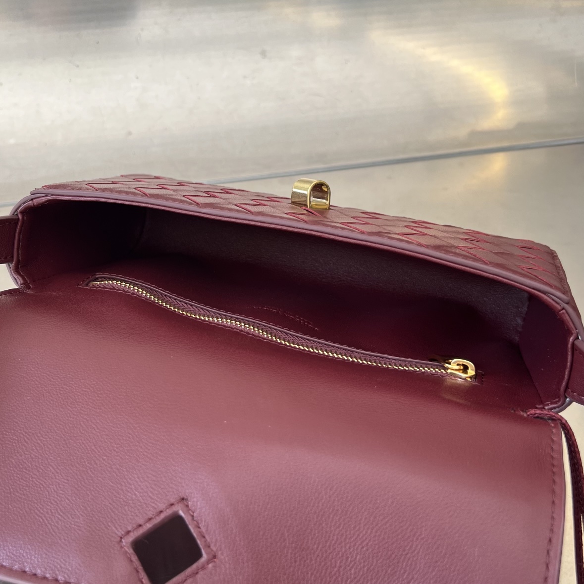 bo*te*ga Ve*ne*ta mini andiamo cross-body bag