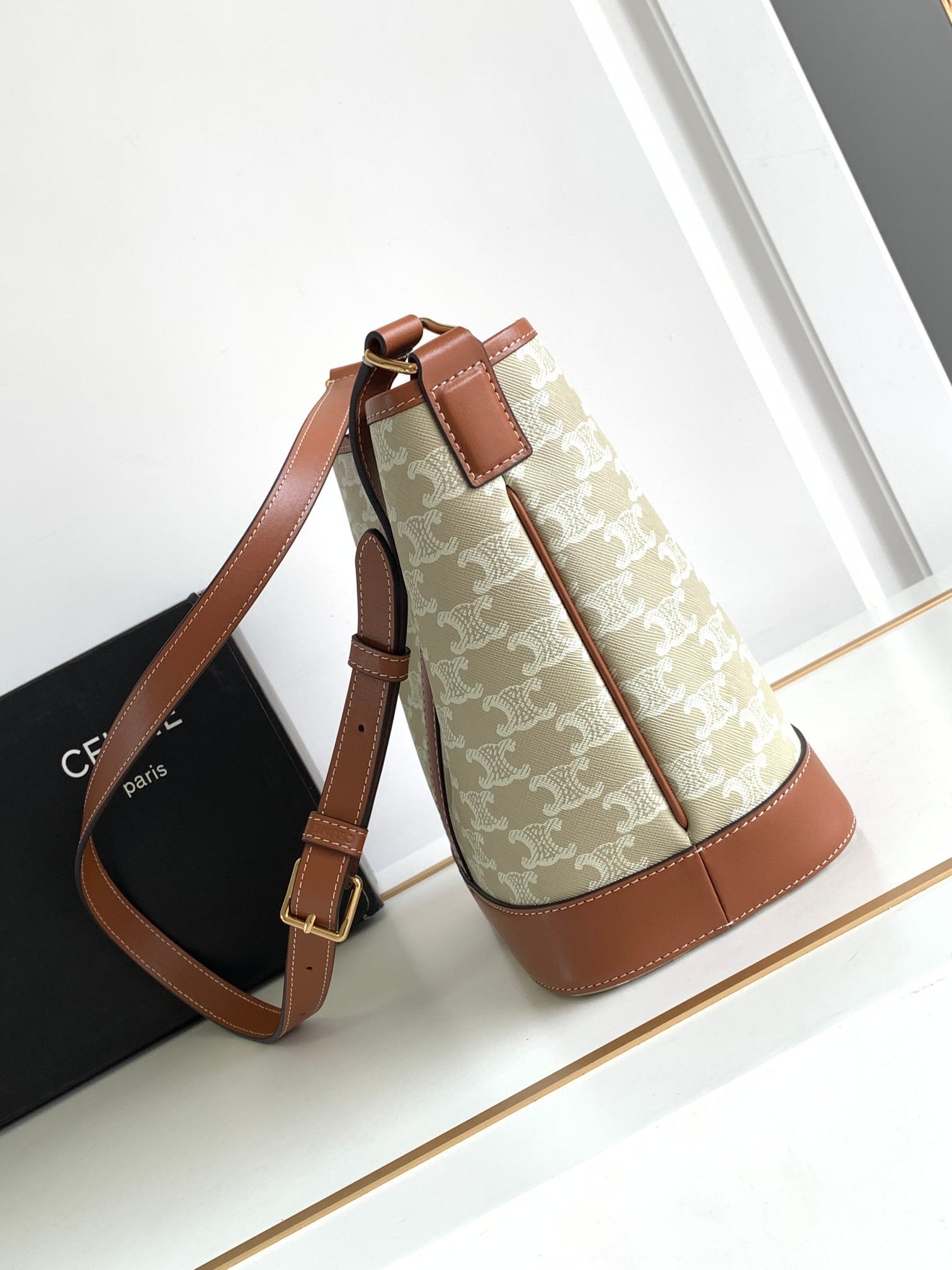 Ce**e small bucket in triomphe canvas and calfskin