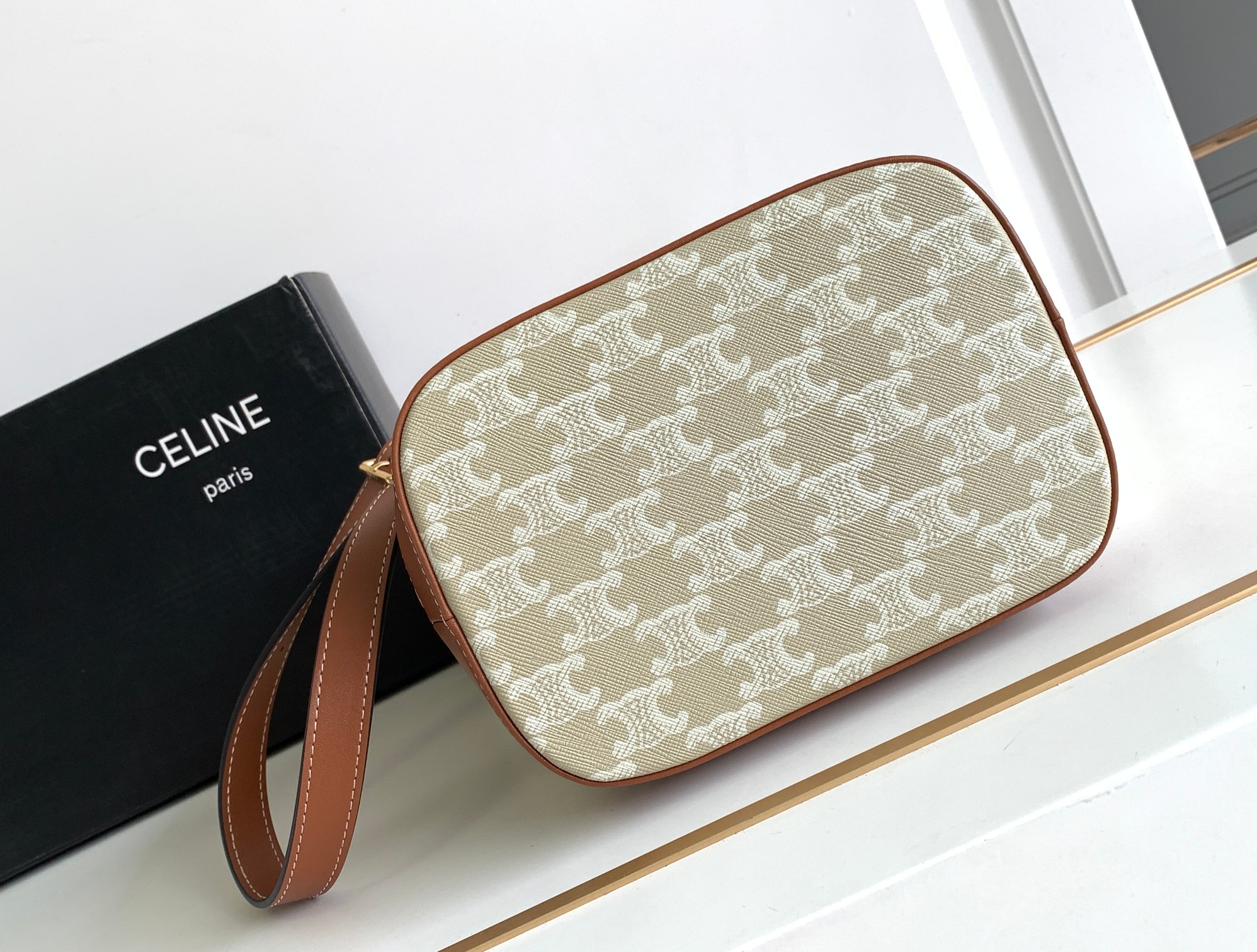 Ce**e small bucket in triomphe canvas and calfskin