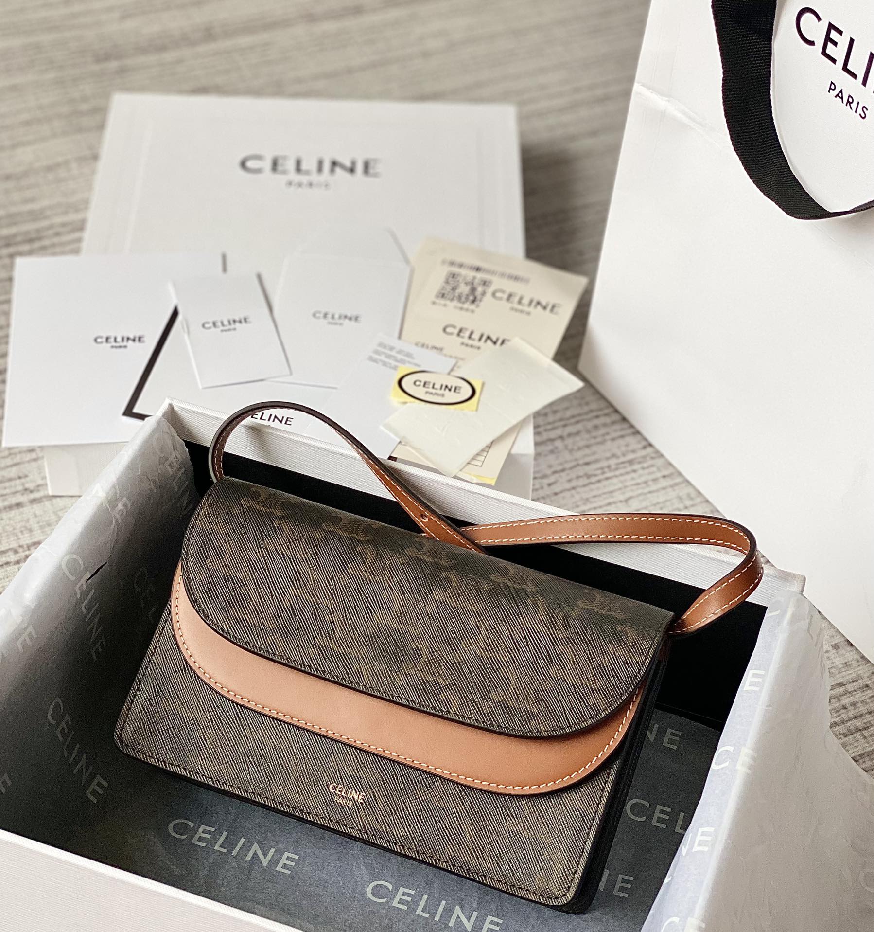 Ce**e wallet on strap in triomphe canvas and smooth lambskin tan