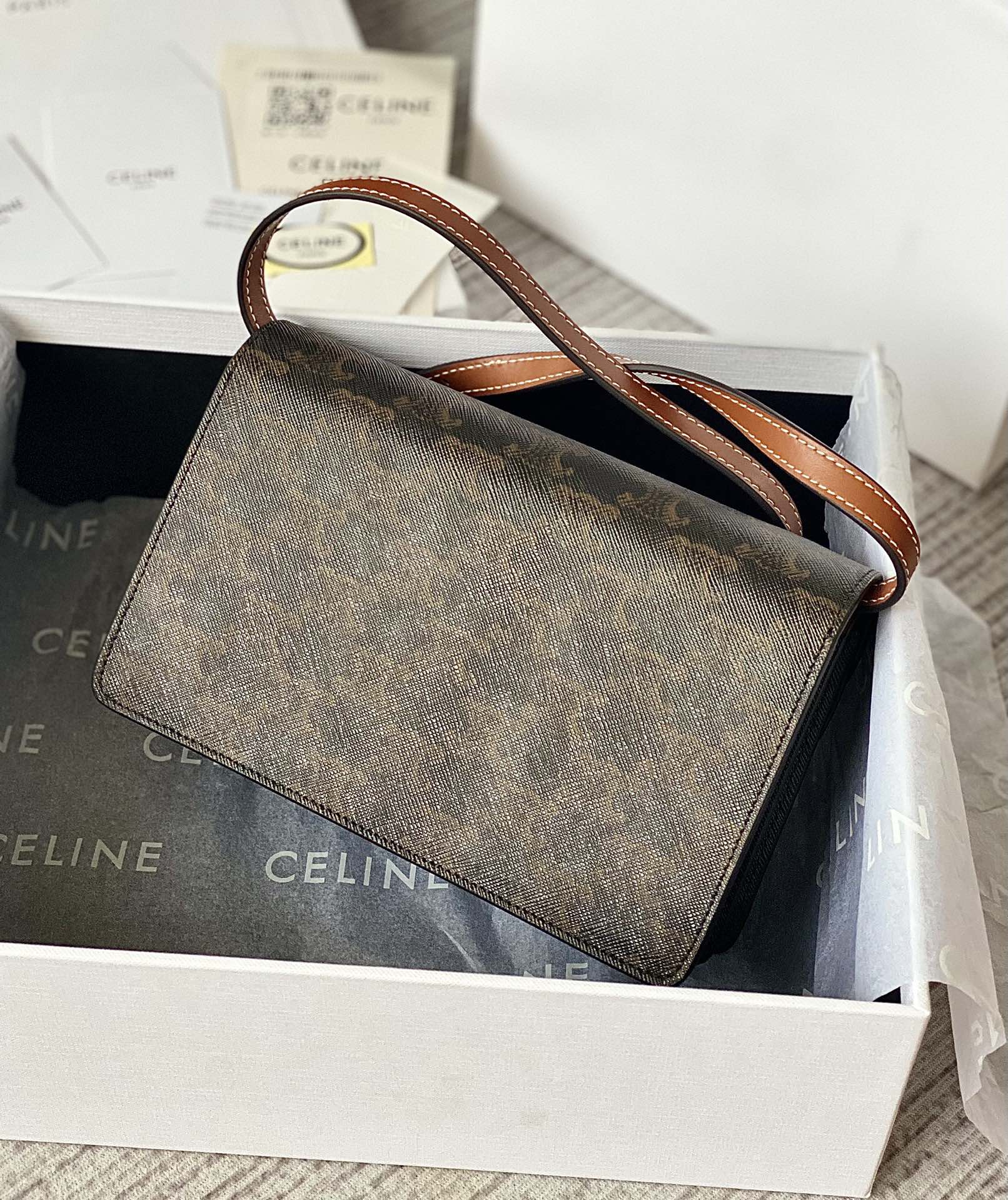 Ce**e wallet on strap in triomphe canvas and smooth lambskin tan