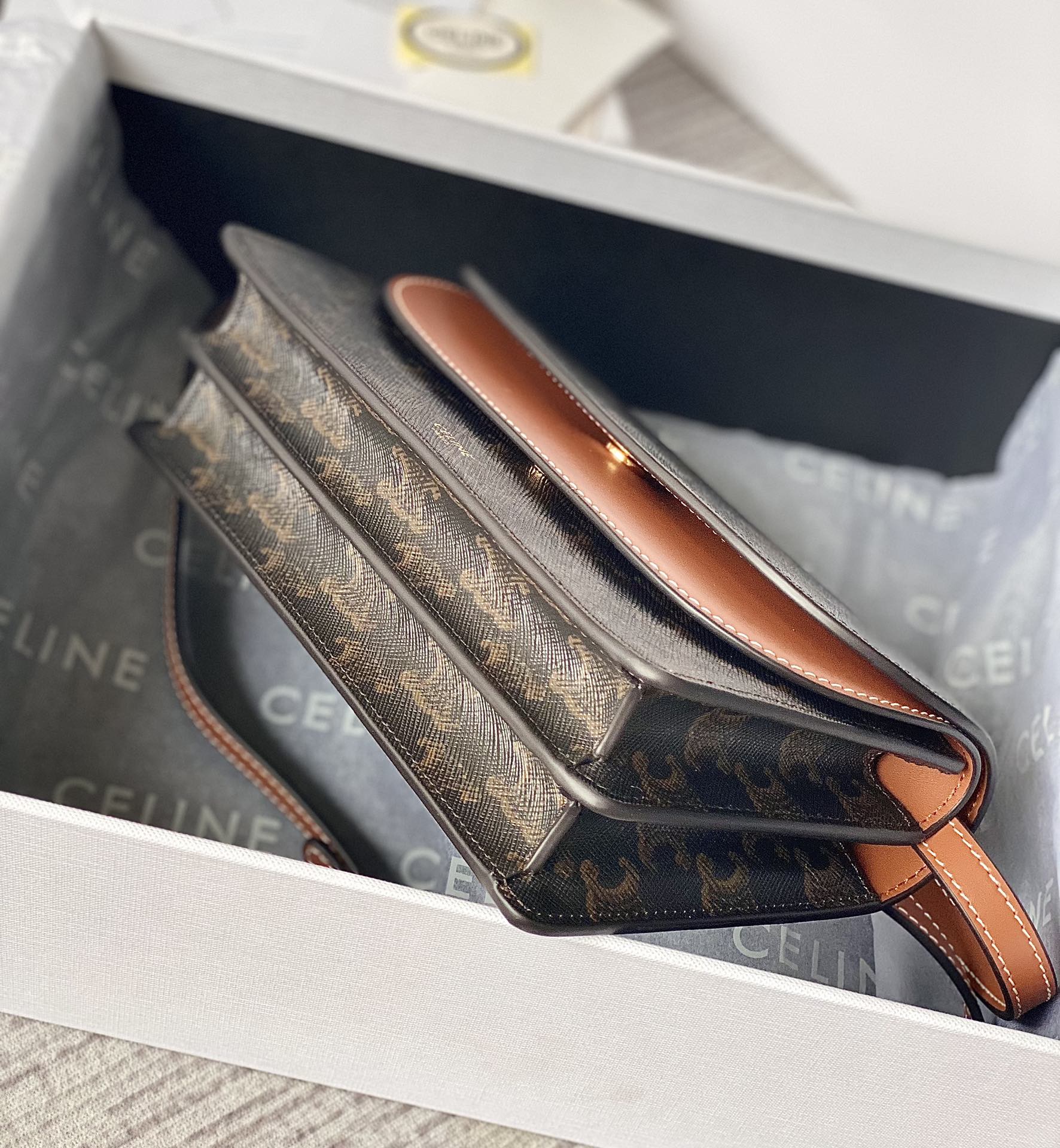Ce**e wallet on strap in triomphe canvas and smooth lambskin tan