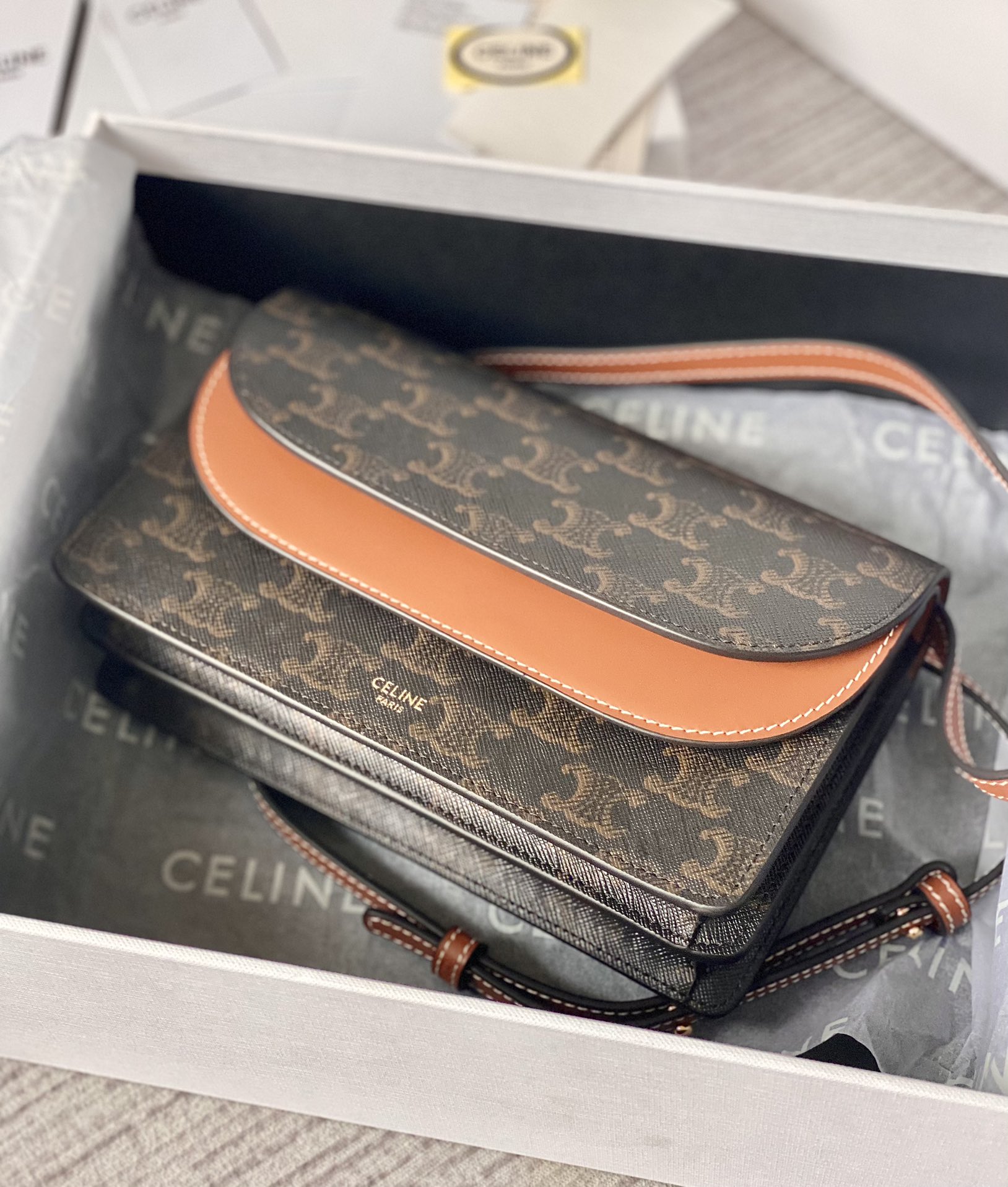 Ce**e wallet on strap in triomphe canvas and smooth lambskin tan