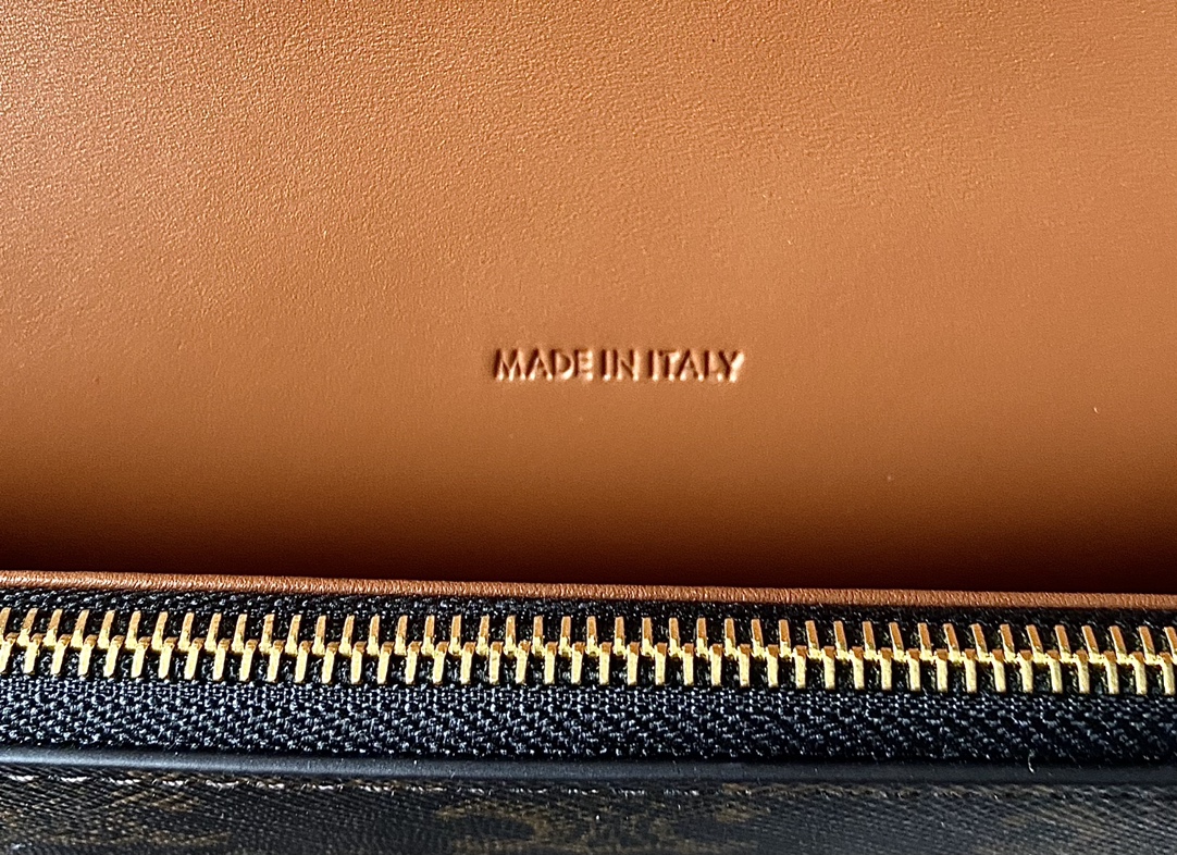 Ce**e wallet on strap in triomphe canvas and smooth lambskin tan