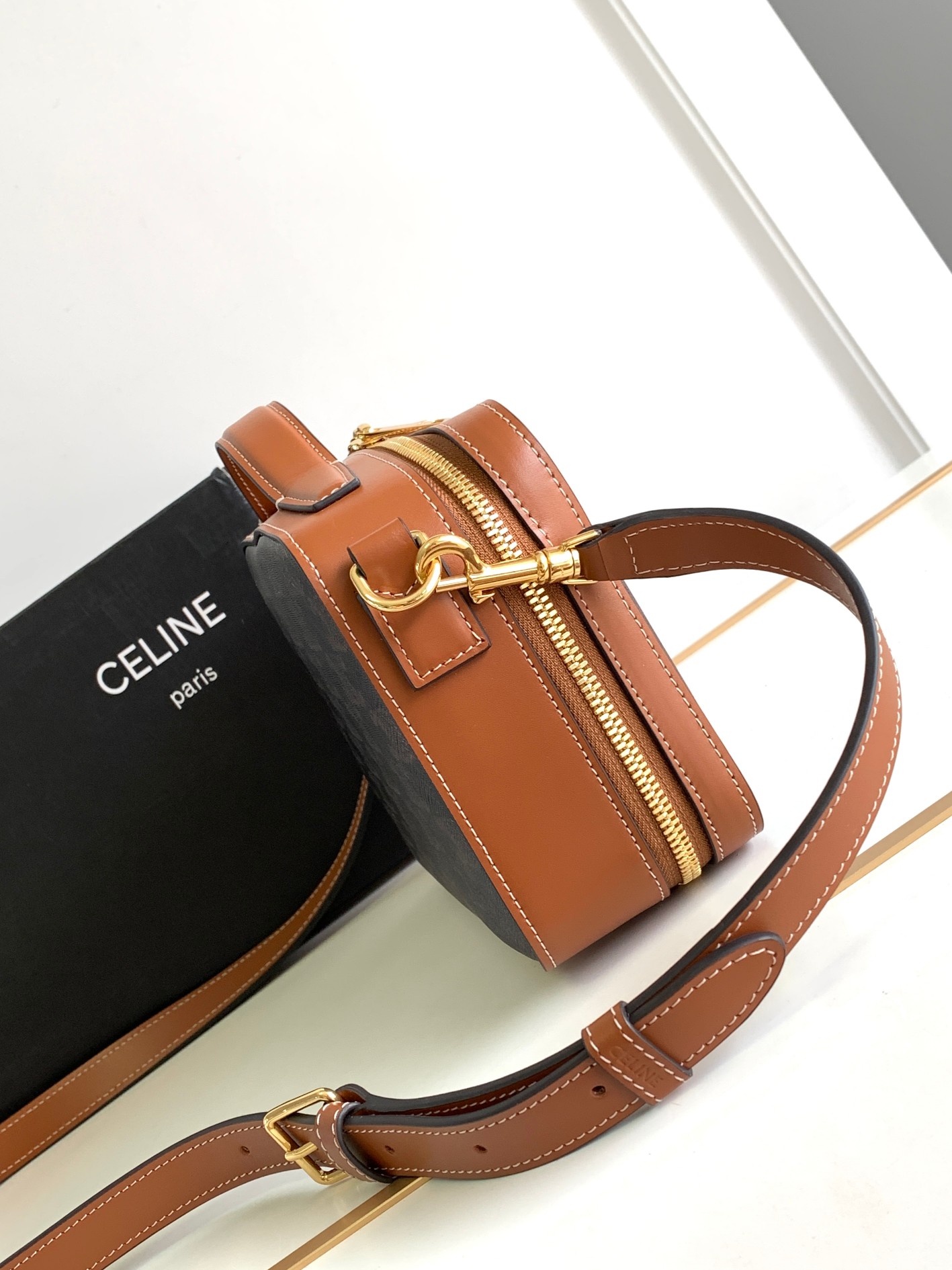 Ce**e messenger box in triomphe canvas and calfskin