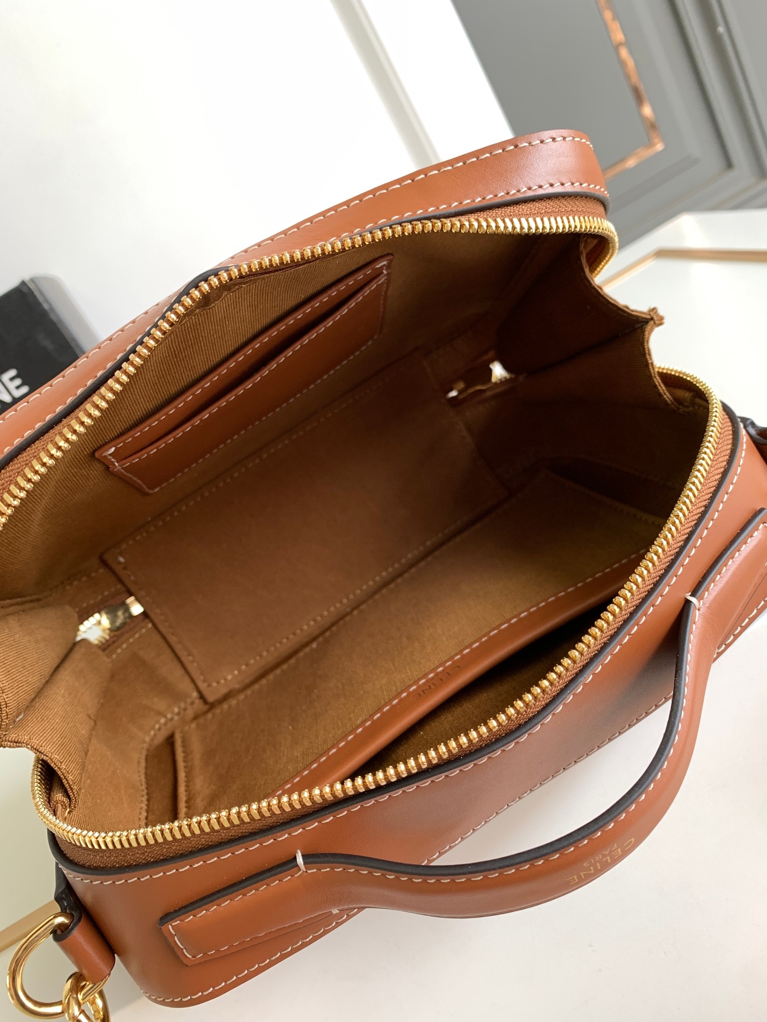 Ce**e messenger box in triomphe canvas and calfskin
