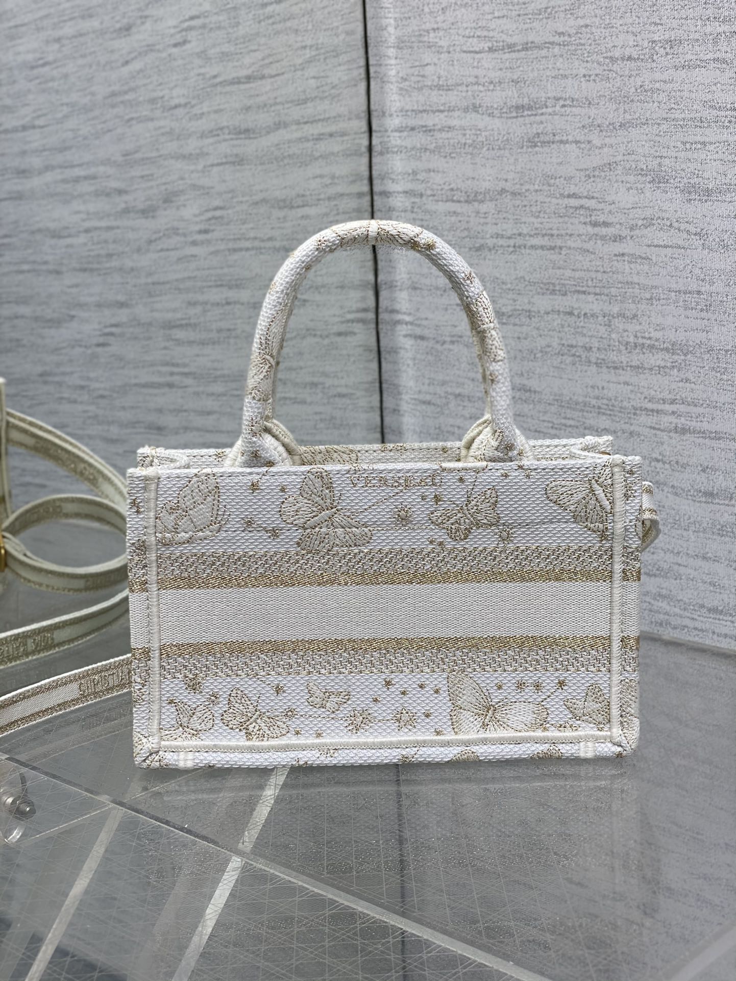 mini D*or book tote with strap