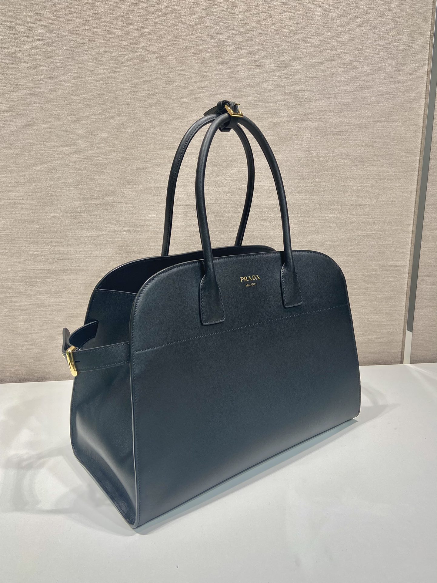 Pra*a large leather tote bag with buckles