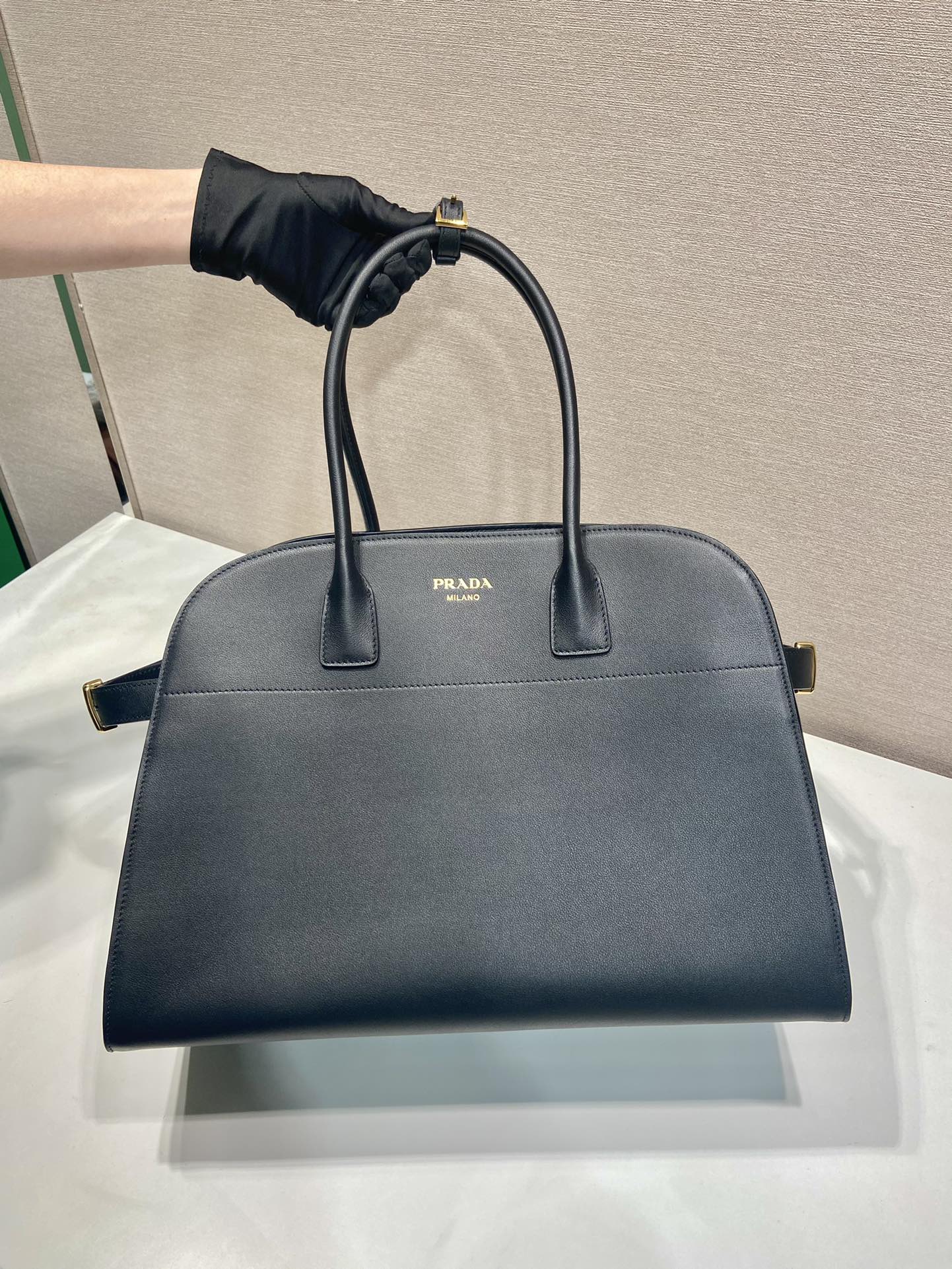 Pra*a large leather tote bag with buckles