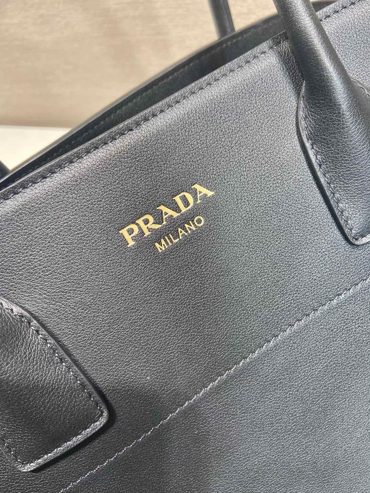 Pra*a large leather tote bag with buckles