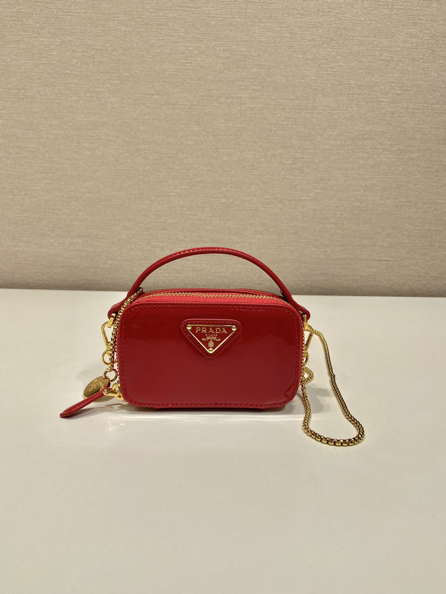 Pra*a patent leather mini-pouch