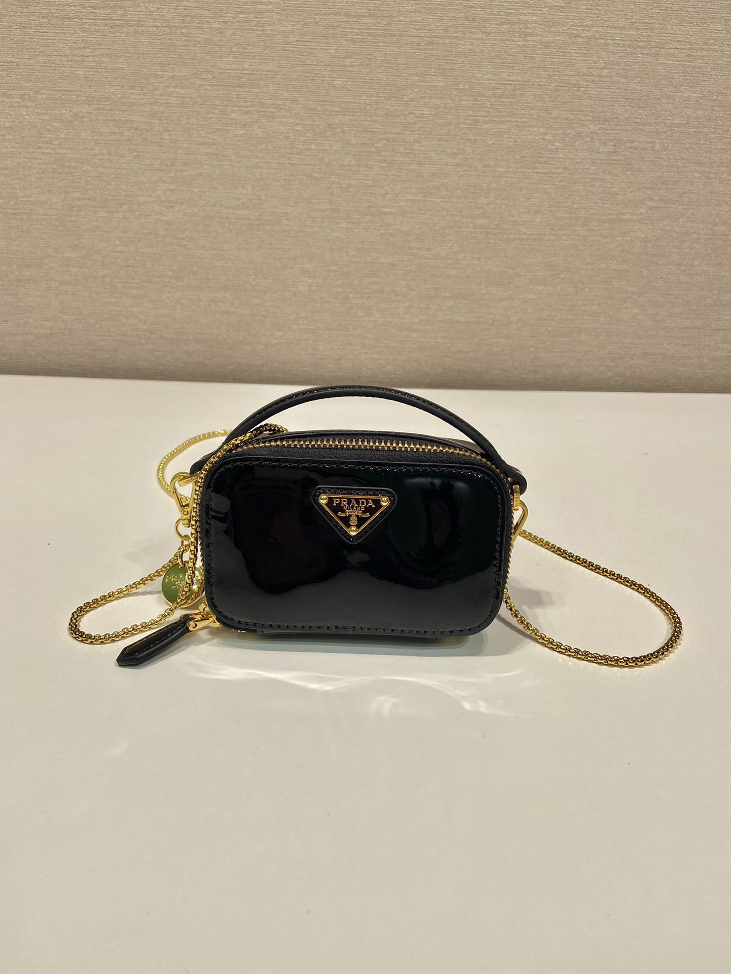 Pra*a patent leather mini-pouch