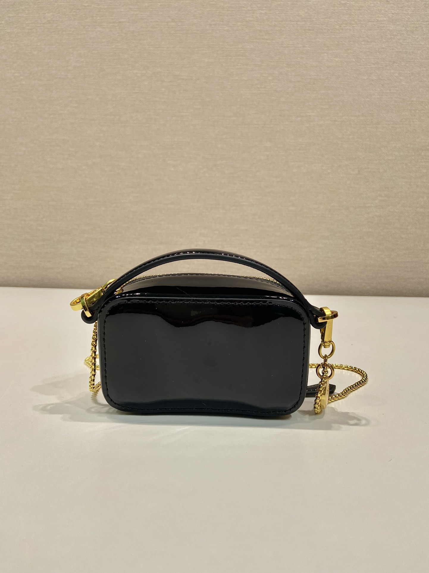 Pra*a patent leather mini-pouch