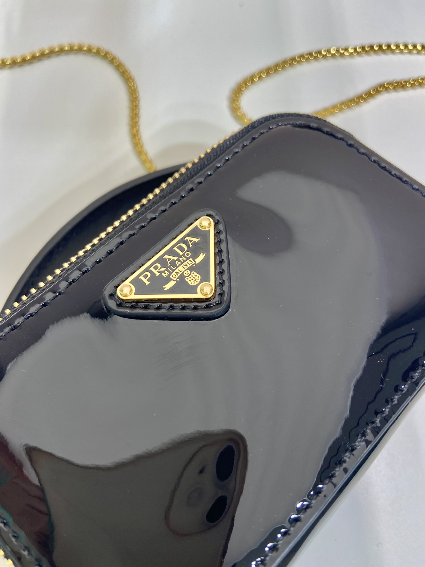 Pra*a patent leather mini-pouch