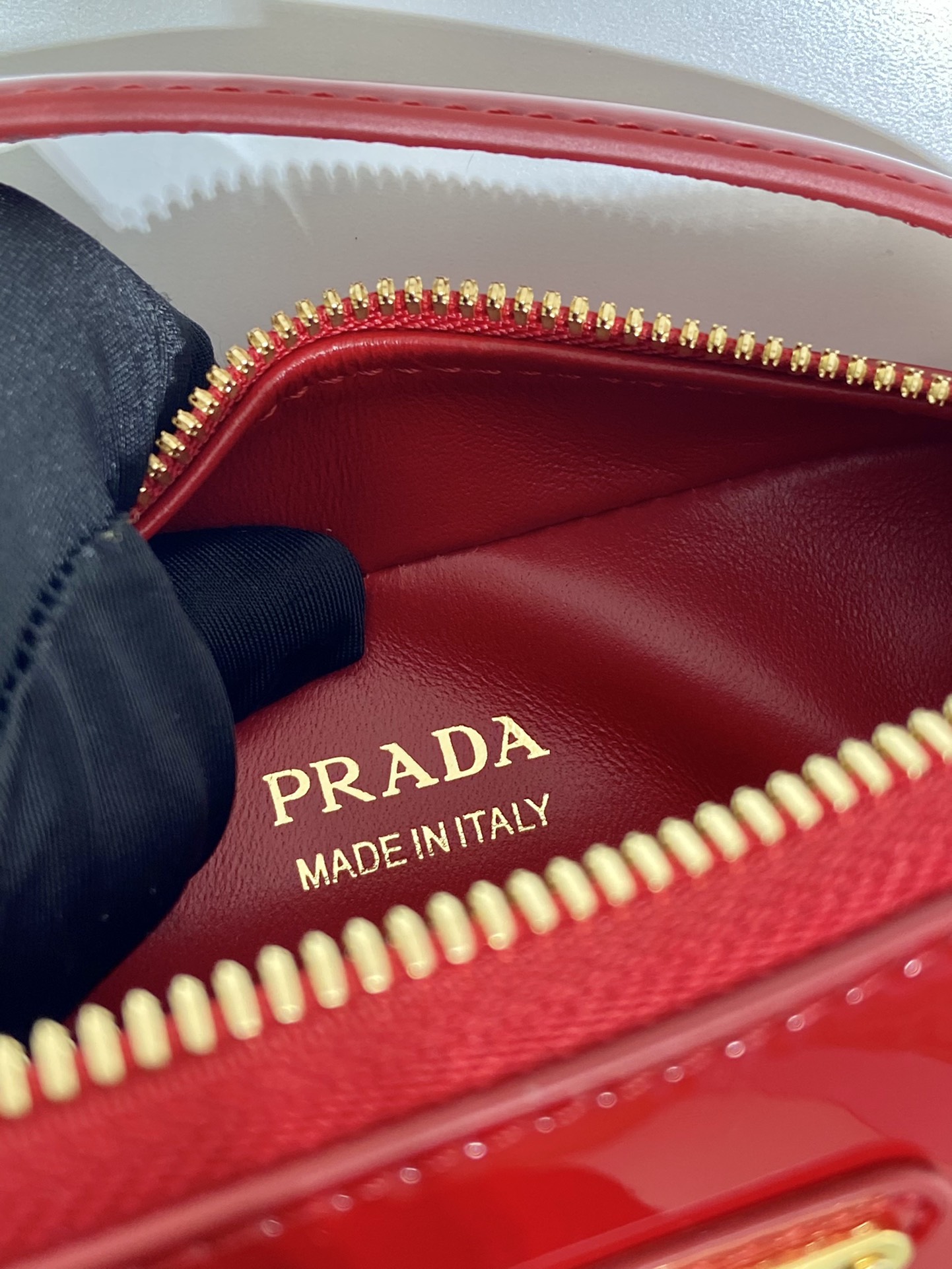 Pra*a odette patent leather mini-bag