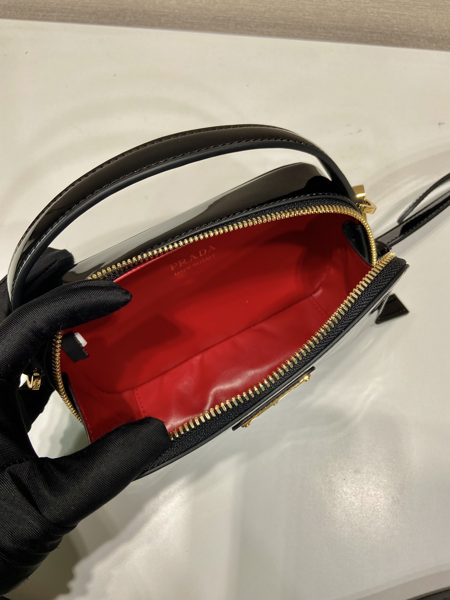 Pra*a odette patent leather mini-bag