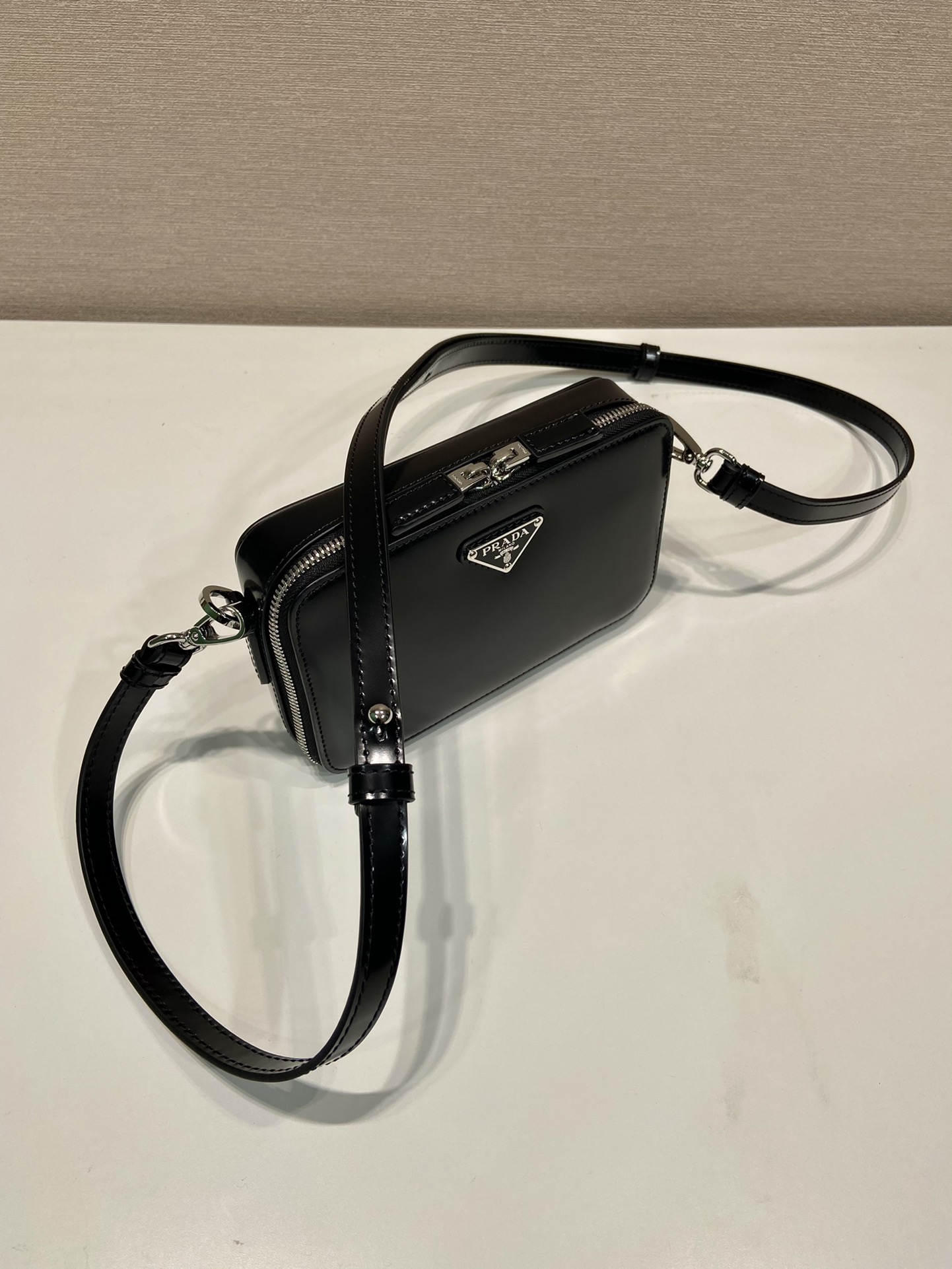 Pra*a brique saffiano leather bag