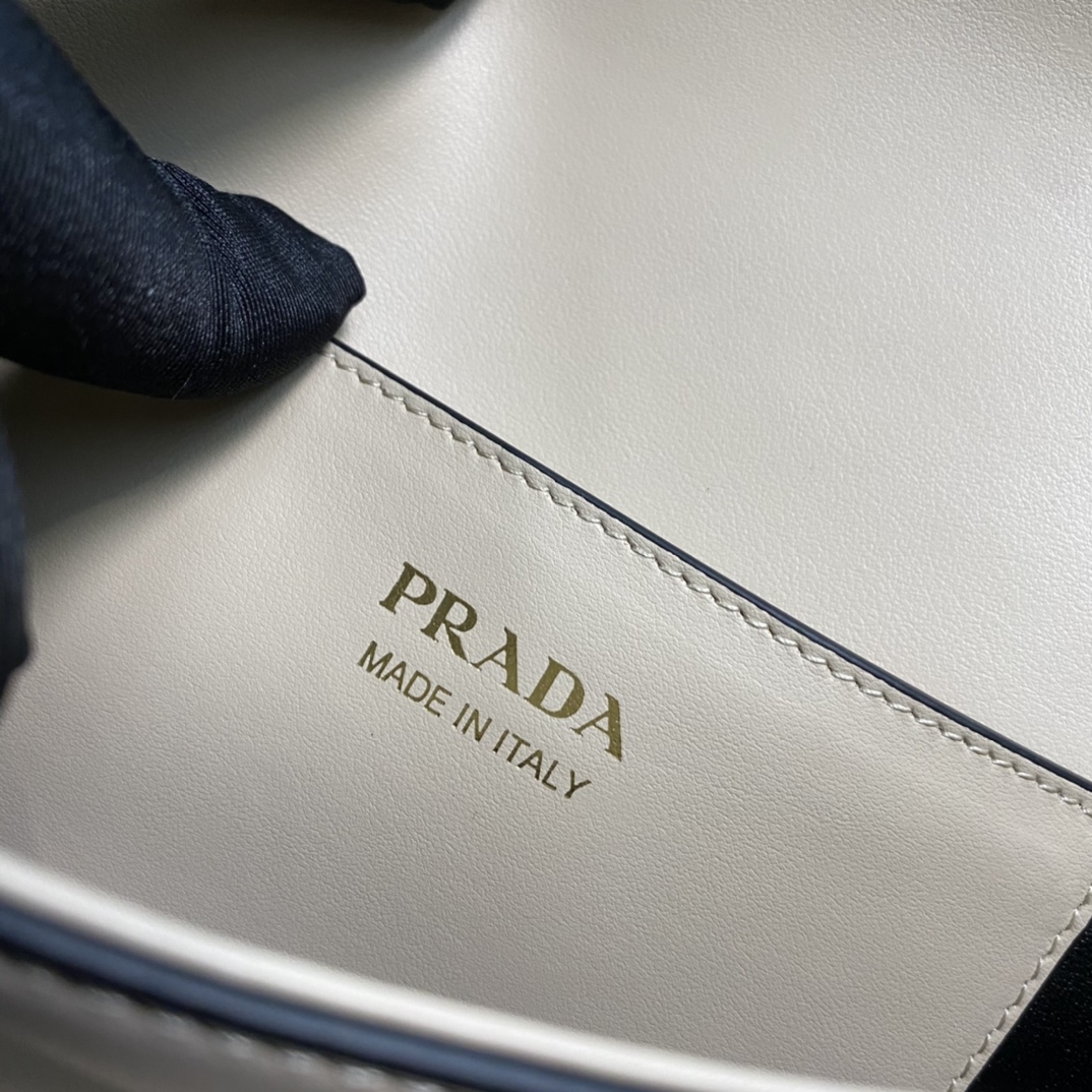 Pra*a arqué leather shoulder bag moon bag