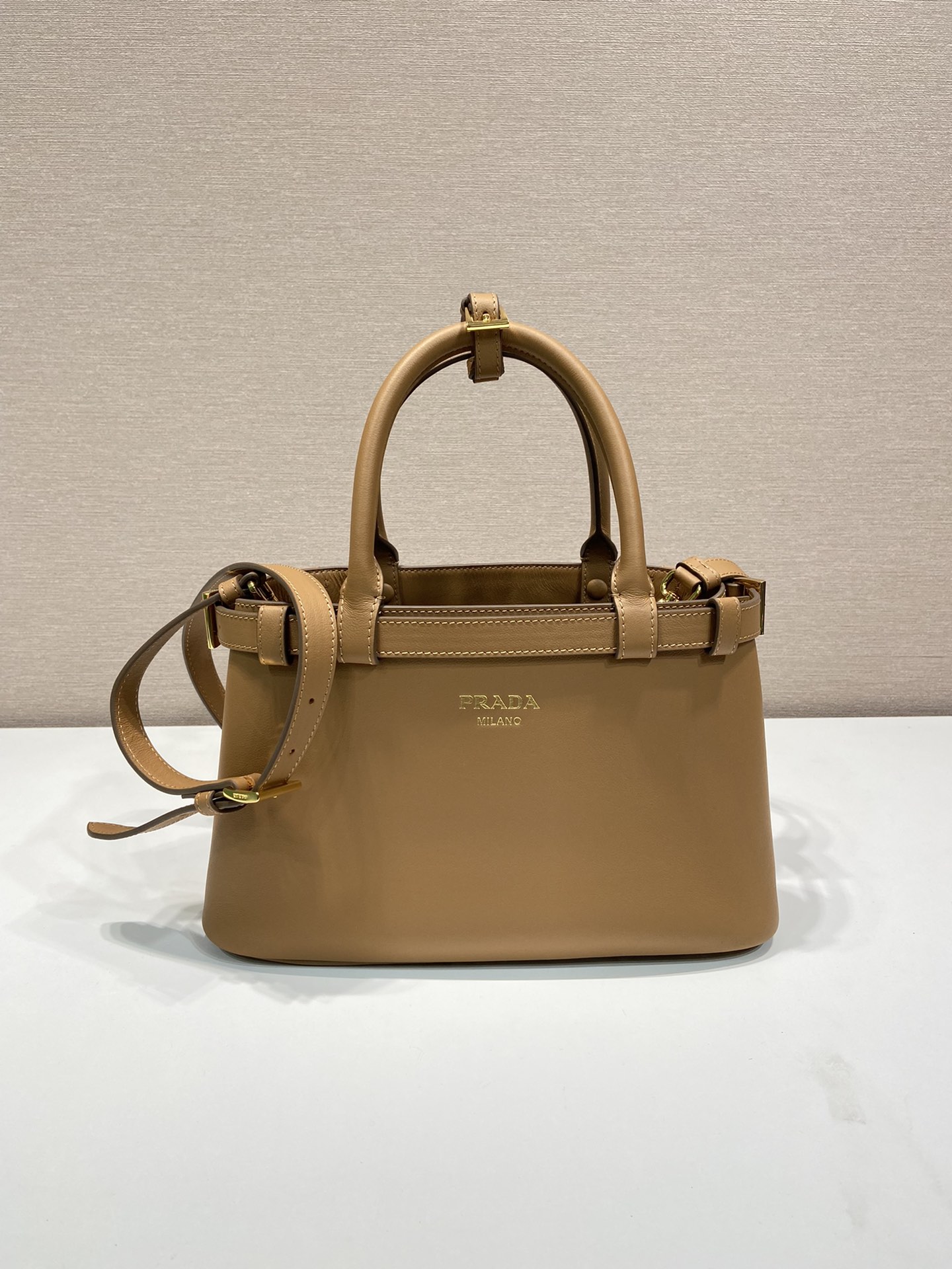 Pra*a buckle small leather handbag with double belt