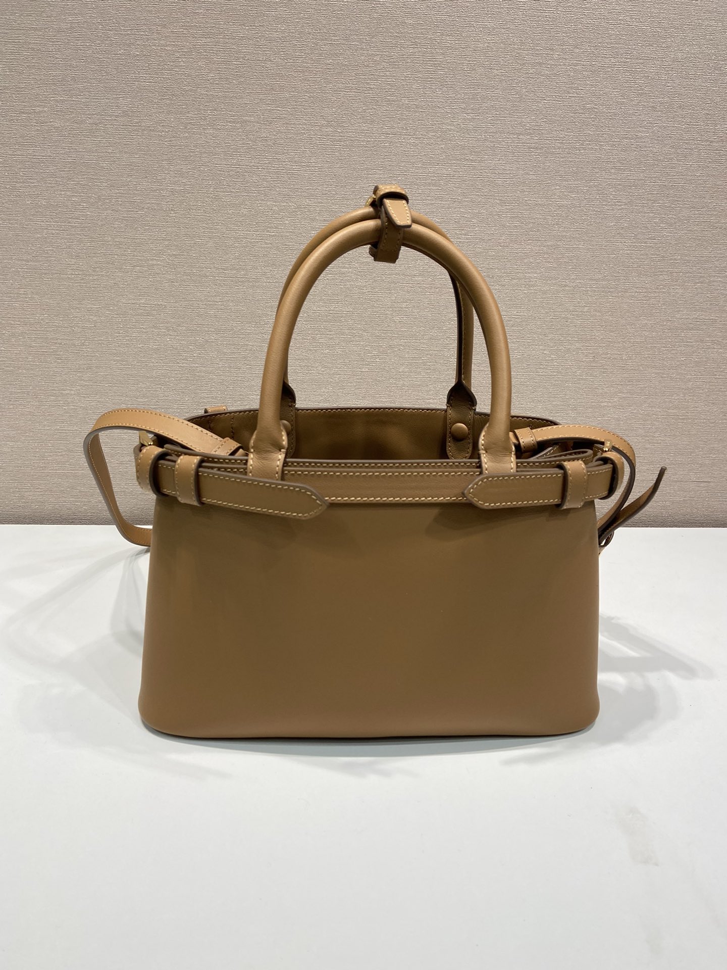 Pra*a buckle small leather handbag with double belt