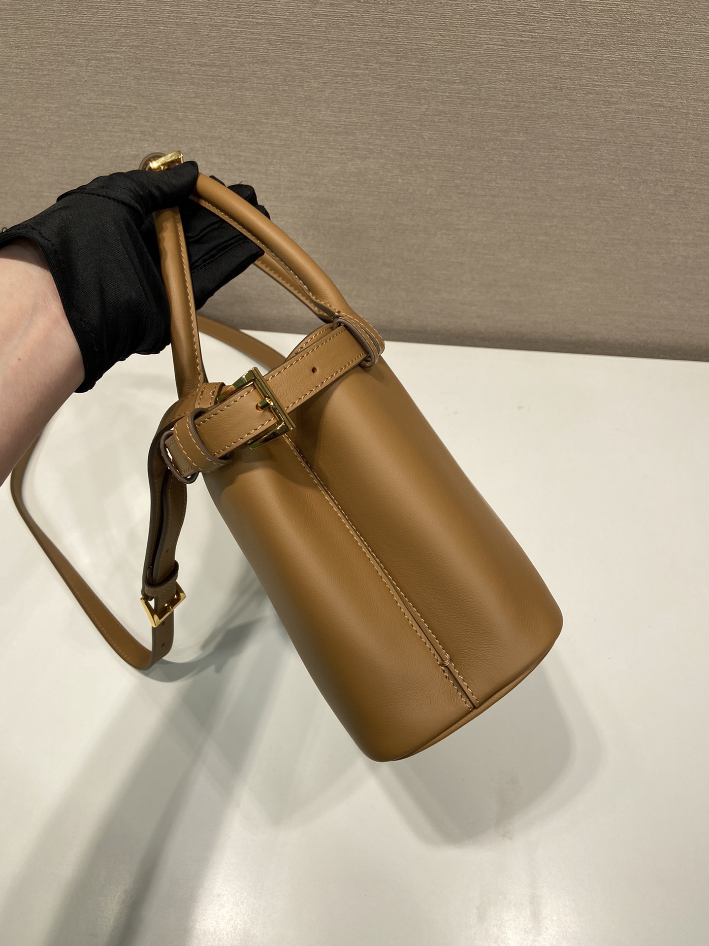 Pra*a buckle small leather handbag with double belt