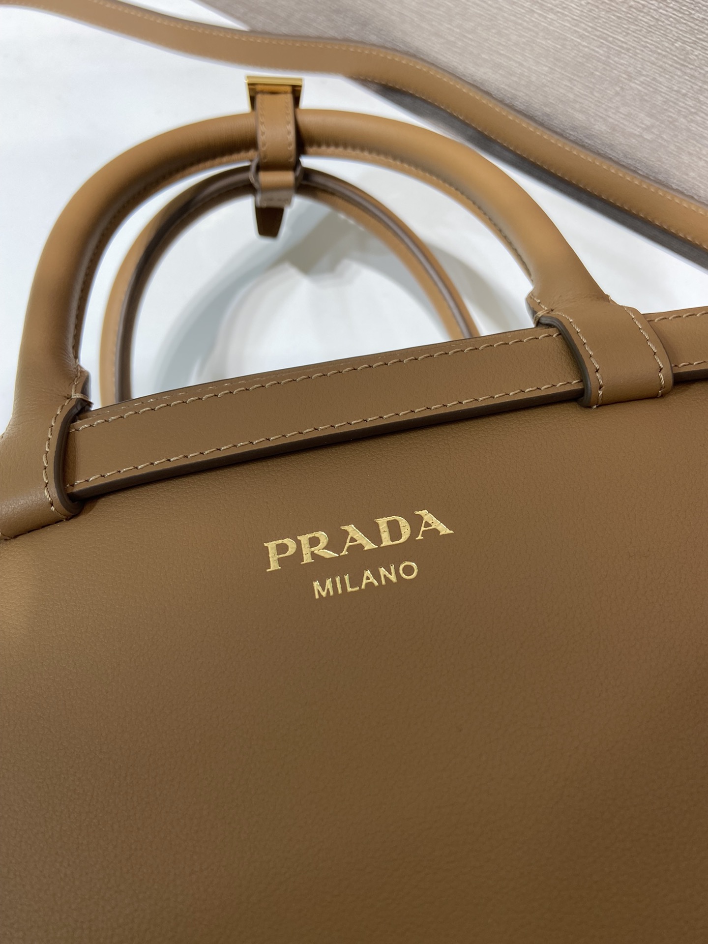 Pra*a buckle small leather handbag with double belt