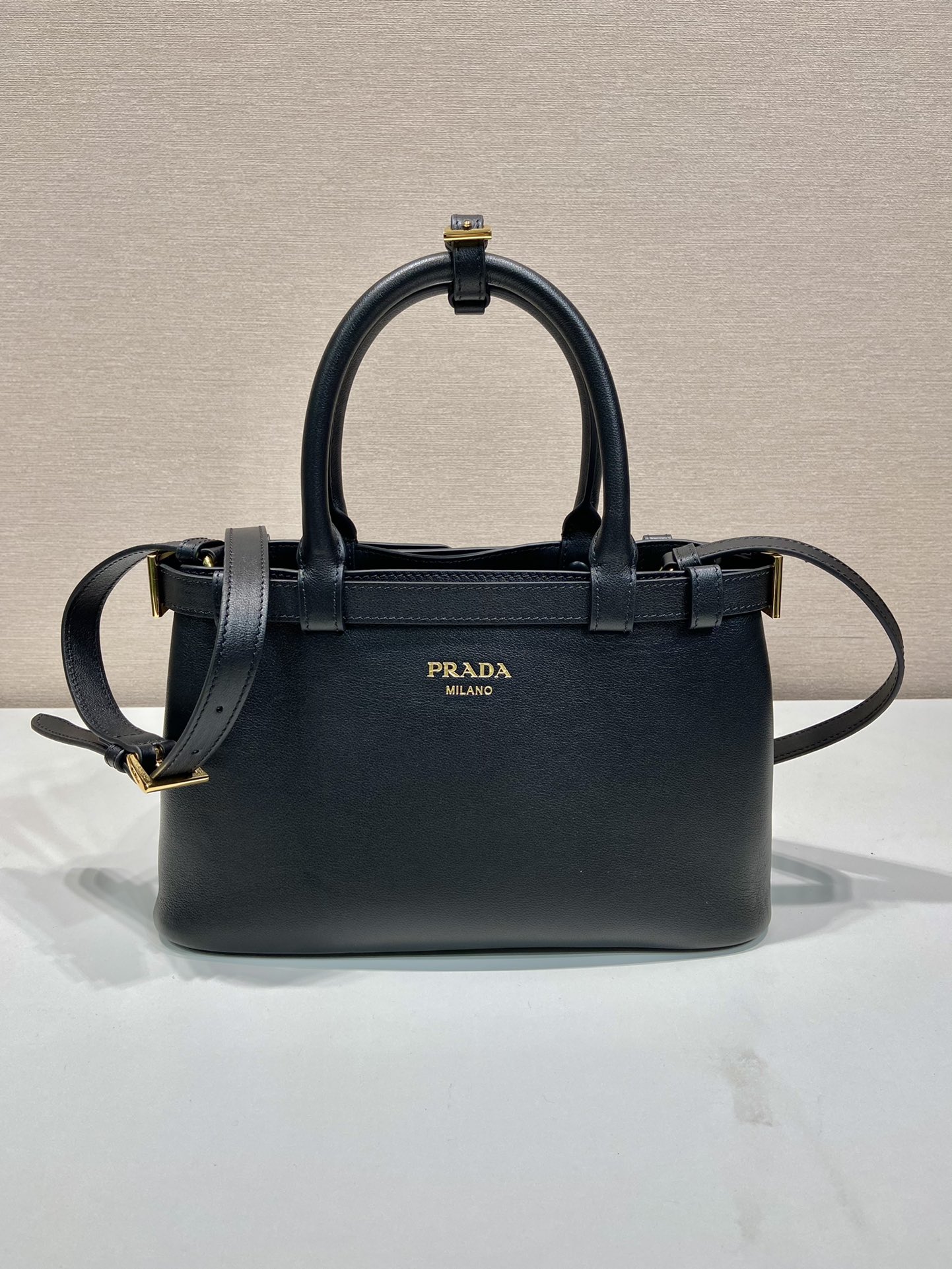 Pra*a buckle small leather handbag with double belt